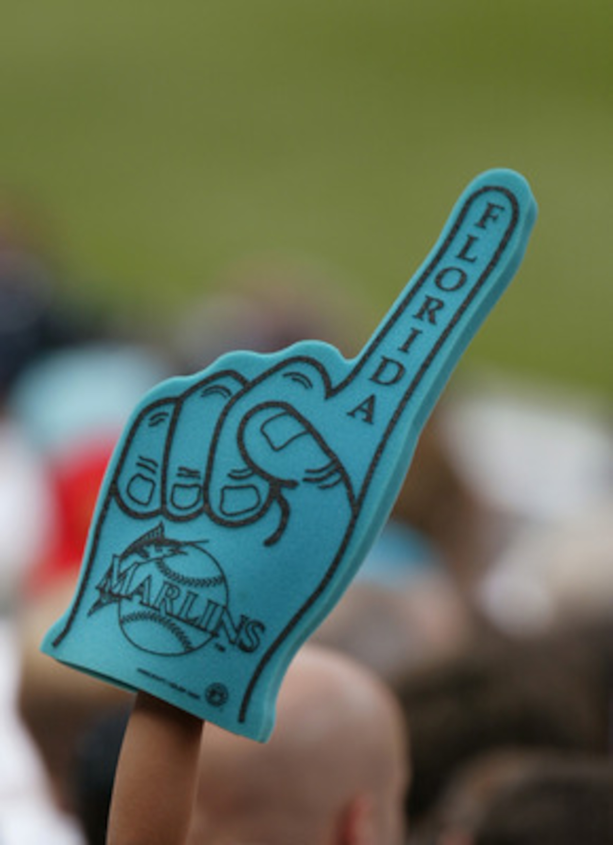 MIAMI - APRIL 6:  A fan holds up a foam Florida Marlins hand during the game against the Montreal Expos on April 6, 2004 at Pro Player Stadium in Miami, Florida.  The Marlins won 4-3. (Photo by Eliot J. Schechter/Getty Images)