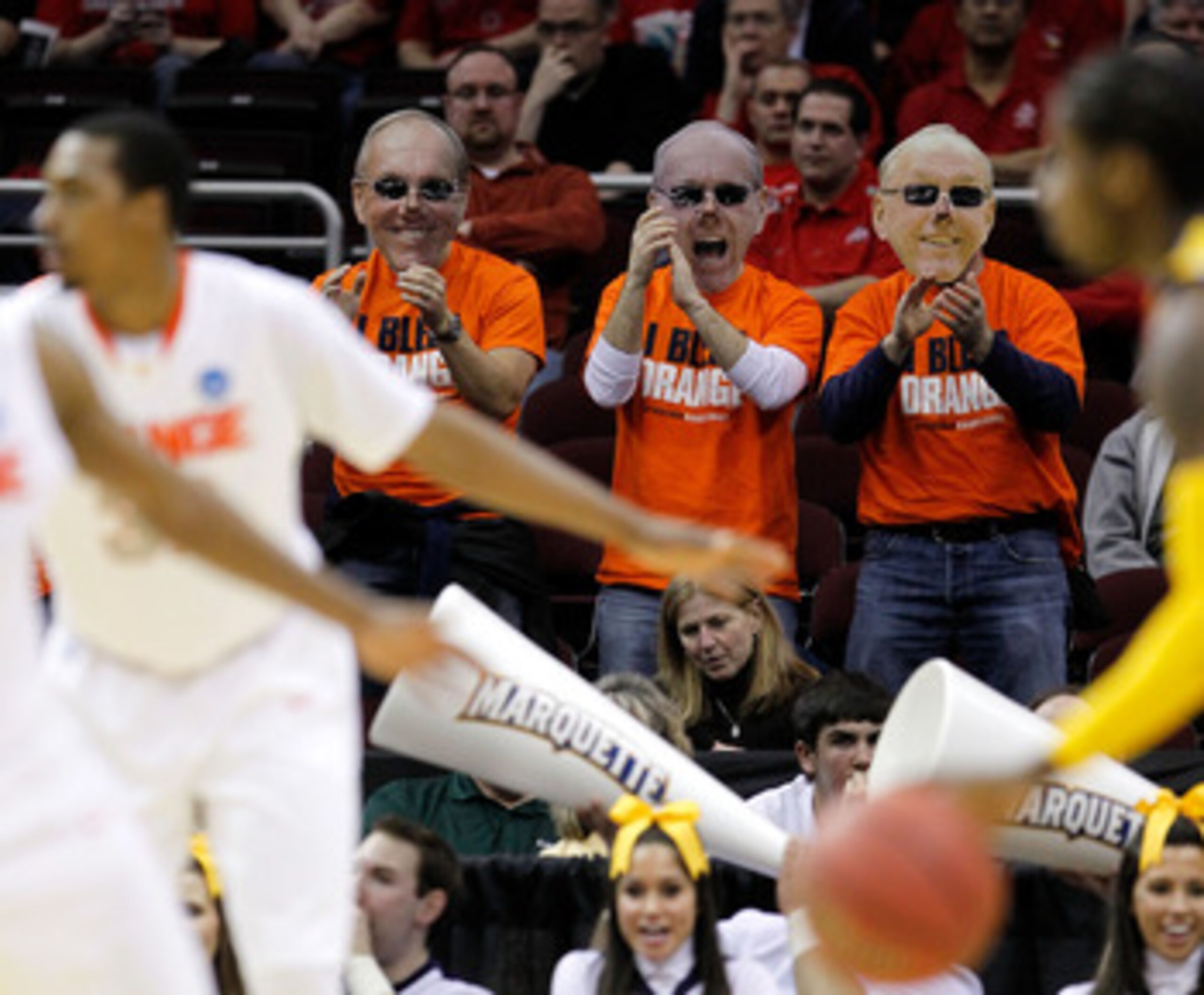 CLEVELAND, OH - MARCH 20: Fans wear head coach Jim Boeheim of the Syracuse Orange masks during the game between the Syracuse Orange and the Marquette Golden Eagles during the third of the 2011 NCAA men's basketball tournament at Quicken Loans Arena on Mar