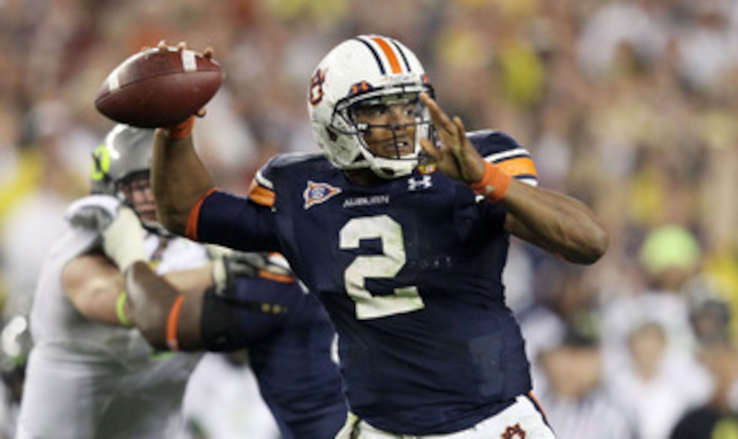 GLENDALE, AZ - JANUARY 10:  Cameron Newton #2 of the Auburn Tigers scrambles against the Oregon Ducks during the Tostitos BCS National Championship Game at University of Phoenix Stadium on January 10, 2011 in Glendale, Arizona.  (Photo by Christian Peters