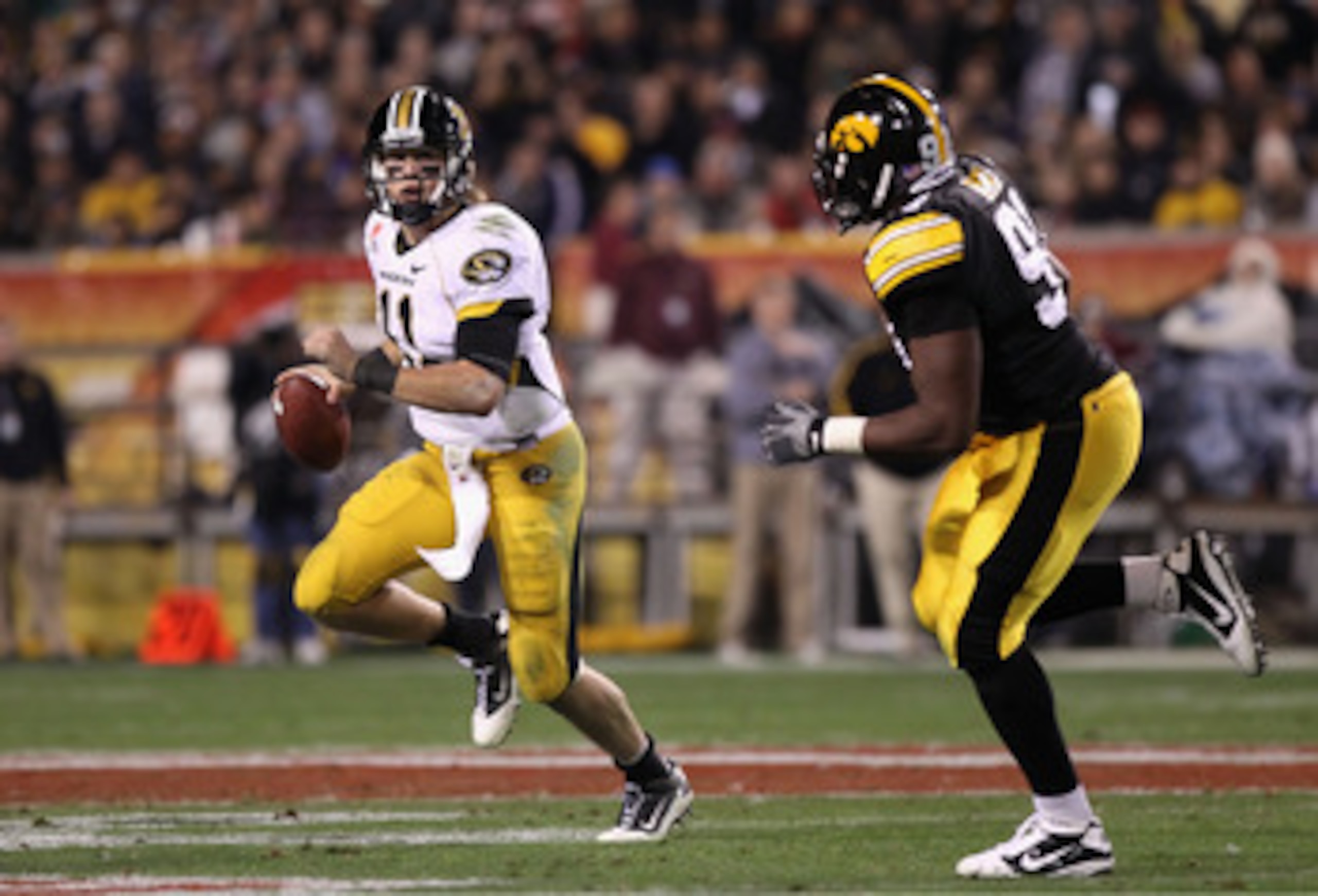TEMPE, AZ - DECEMBER 28:  Quarterback Blaine Gabbert #11 of the Missouri Tigers drops back to pass during the Insight Bowl against the Iowa Hawkeyes  at Sun Devil Stadium on December 28, 2010 in Tempe, Arizona.  The Hawkeyes defeated the Tigers 27-24.  (P