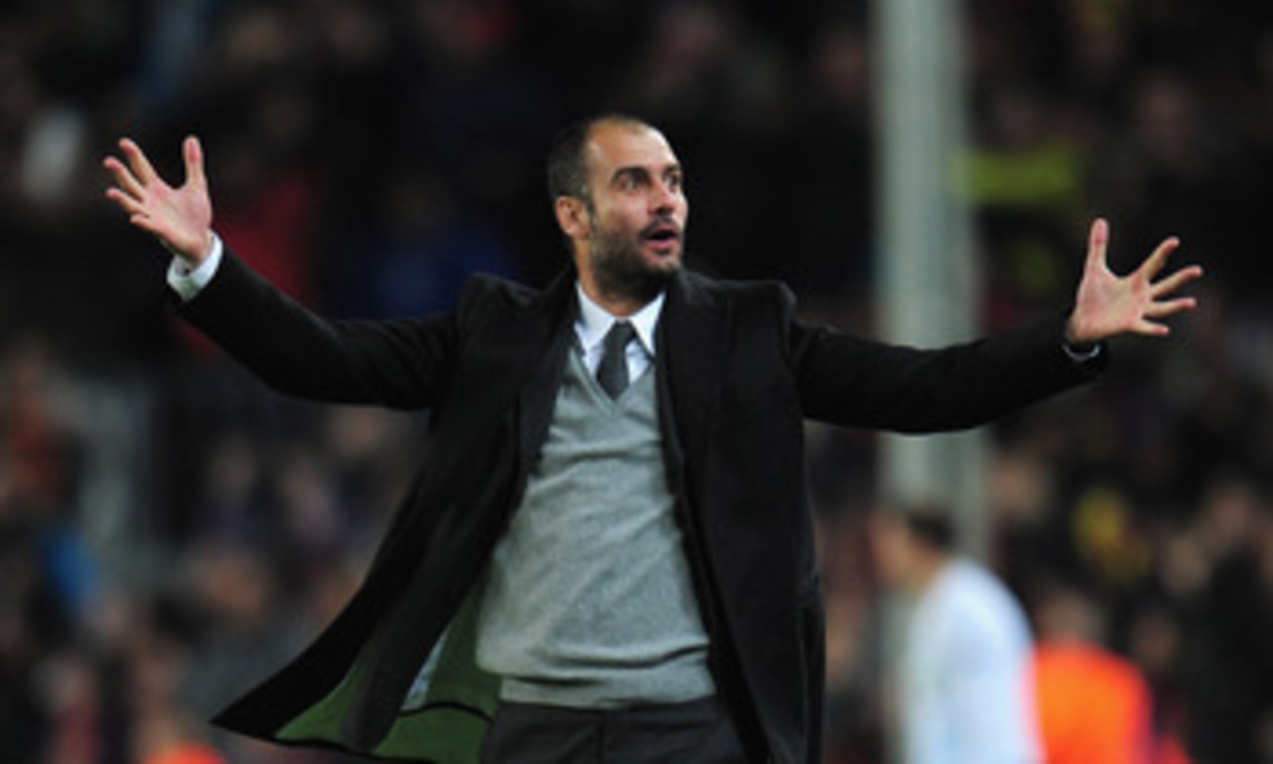 BARCELONA, SPAIN - MARCH 08:  Josep Guardiola the Barcelona coach celebrates  during the UEFA Champions League round of 16 second leg match between Barcelona and Arsenal at the Nou Camp Stadium on March 8, 2011 in Barcelona, Spain.  (Photo by Shaun Botter
