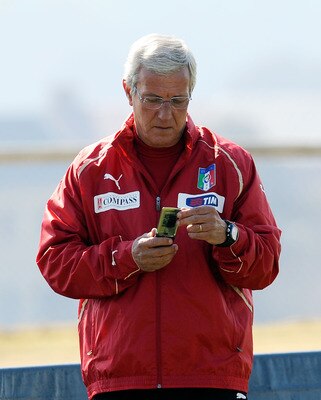 CENTURION, SOUTH AFRICA - JUNE 22:  Head coach Marcello Lippi looks at his phone during an Italy training session ahead of their 2010 FIFA World Cup Group Stage Round 3 Group F match against Slovakia  on June 22, 2010 in Centurion, South Africa.  (Photo b