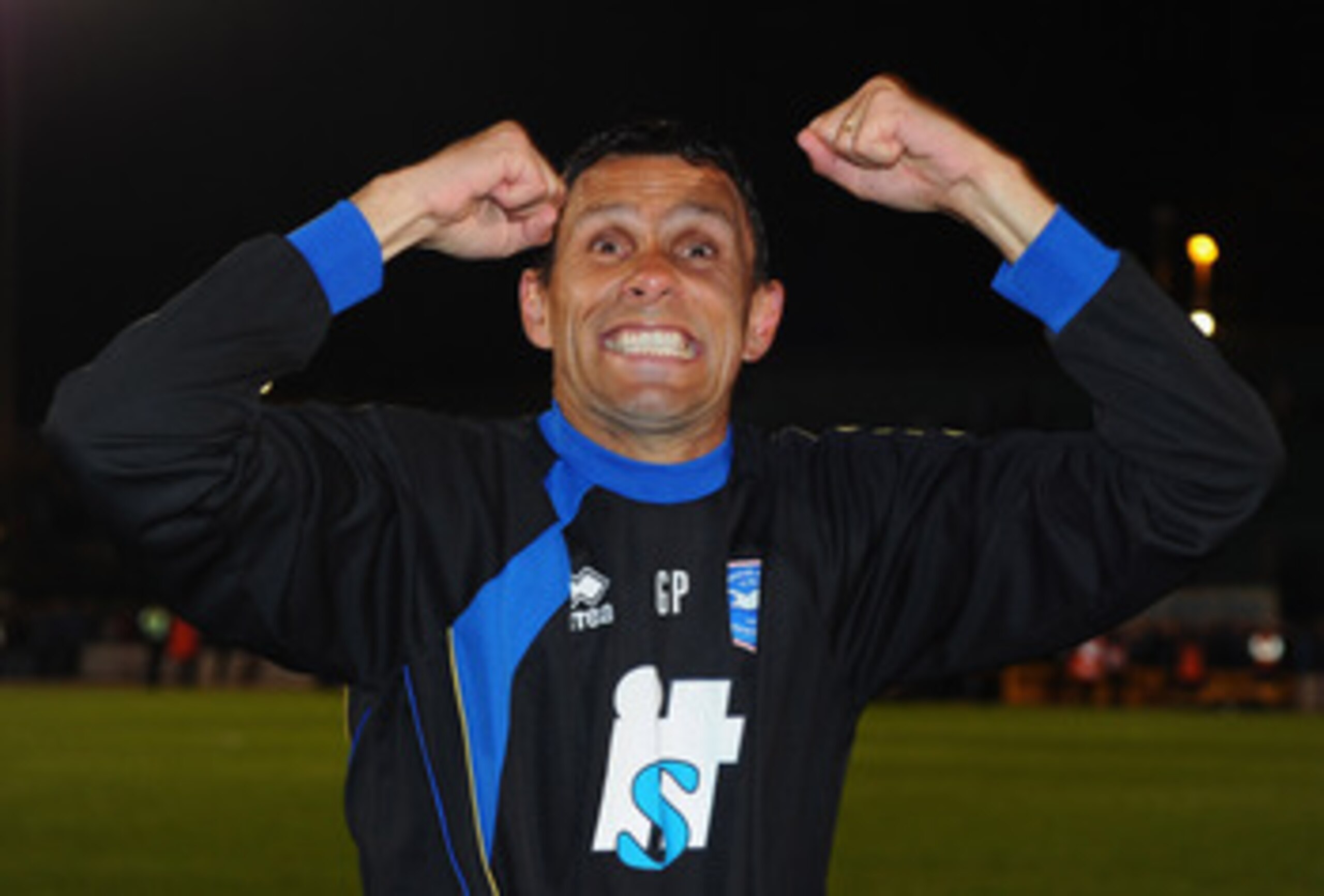 BRIGHTON, ENGLAND - APRIL 12:  Brighton manager Gus Poyet celebrates promotion after the npower League One match between Brighton & Hove Albion and Dagenham & Redbridge at Withdean Stadium on April 12, 2011 in Brighton, United Kingdom.  (Photo by Mike Hew