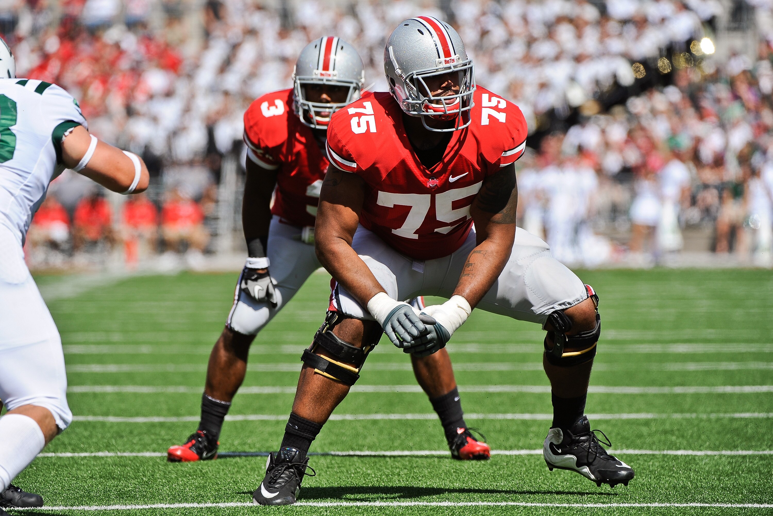 COLUMBUS, OH - SEPTEMBER 18:  Mike Adams #75 of the Ohio State Buckeyes looks for his blocking assignment against the Ohio Bobcats at Ohio Stadium on September 18, 2010 in Columbus, Ohio.  (Photo by Jamie Sabau/Getty Images)