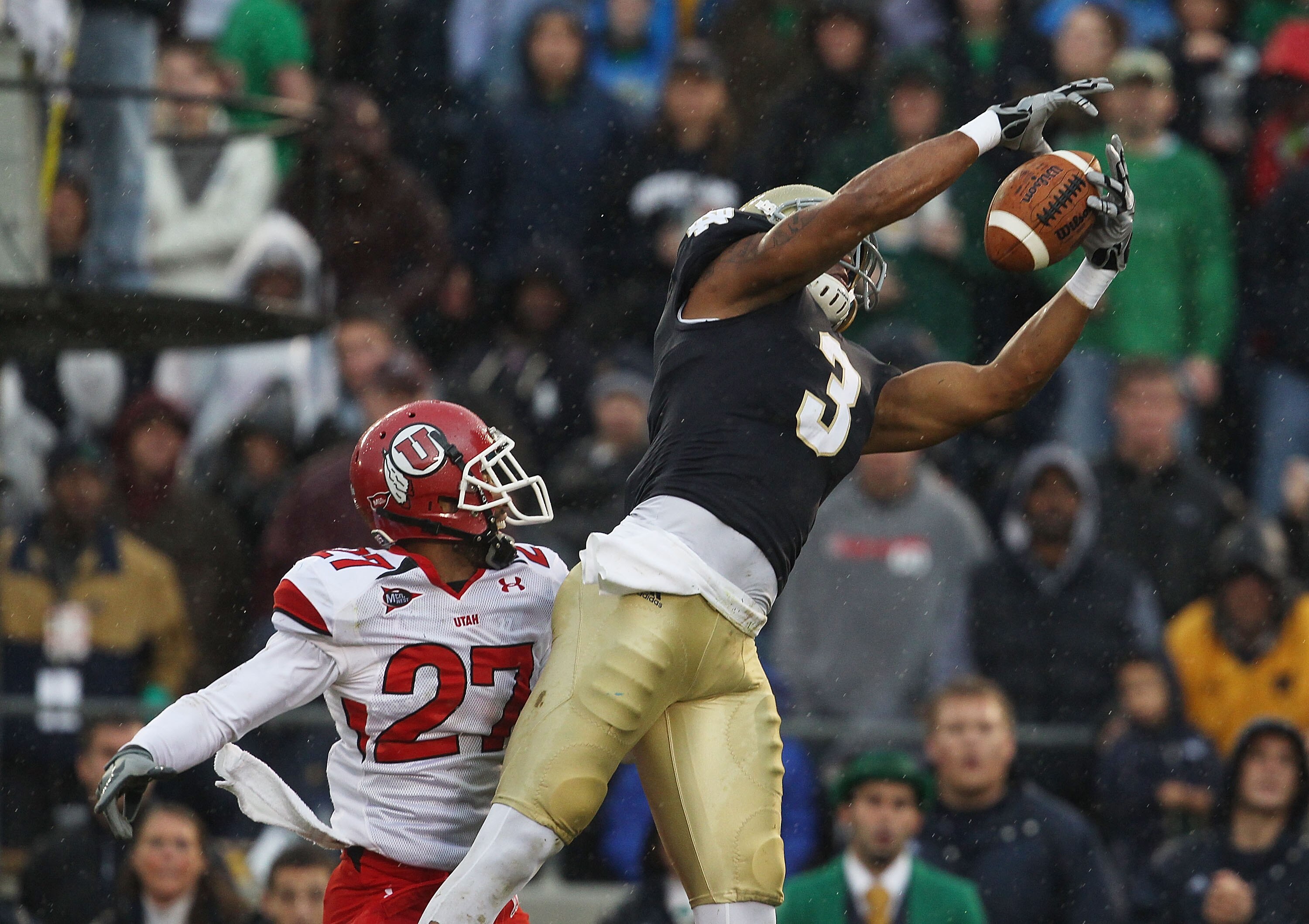 SOUTH BEND, IN - NOVEMBER 13: Michael  Floyd #3 of the Notre Dame Fighting Irish catches a touchdown pass over Brandon Burton #27 of the Utah Utes at Notre Dame Stadium on November 13, 2010 in South Bend, Indiana. (Photo by Jonathan Daniel/Getty Images)