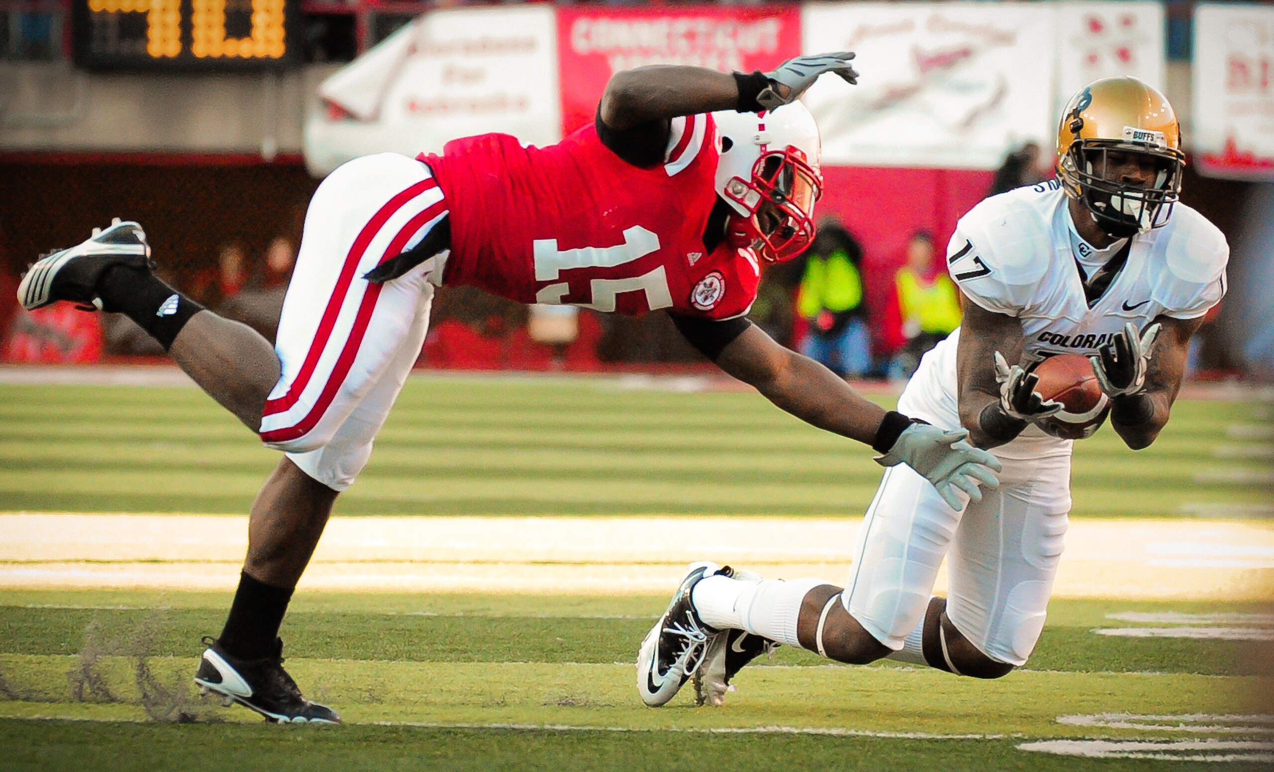 LINCOLN, NE - NOVEMBER 26: Alfonzo Dennard #15 of the Nebraska Cornhuskers attempts to break up a pass intended for Toney Clemons #17 of the Colorado Buffaloes during their game at Memorial Stadium on November 26, 2010 in Lincoln, Nebraska. Nebraska defea