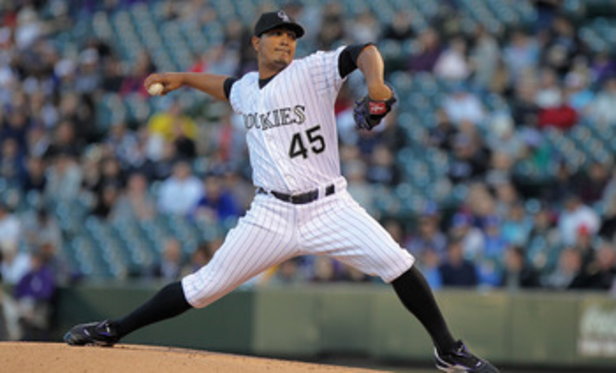 DENVER, CO - APRIL 05:  Starting pitcher Jhoulys Chacin #45 of the Colorado Rockies delivers against the Los Angeles Dodgers at Coors Field on April 5, 2011 in Denver, Colorado.  (Photo by Doug Pensinger/Getty Images)