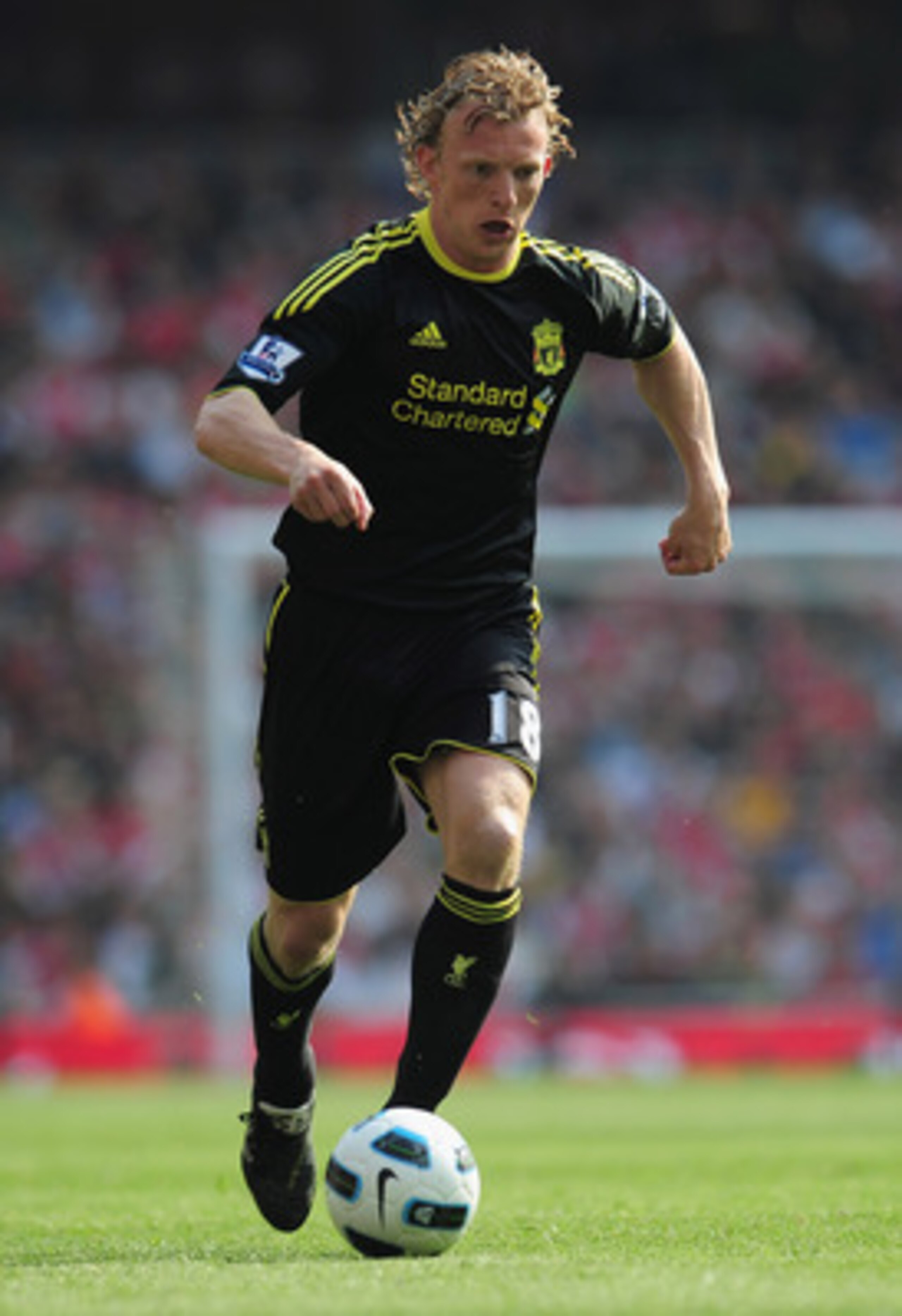 LONDON, ENGLAND - APRIL 17:  Dirk Kuyt of Liverpool runs with the ball during the Barclays Premier League match between Arsenal and Liverpool at the Emirates Stadium on April 17, 2011 in London, England.  (Photo by Shaun Botterill/Getty Images)