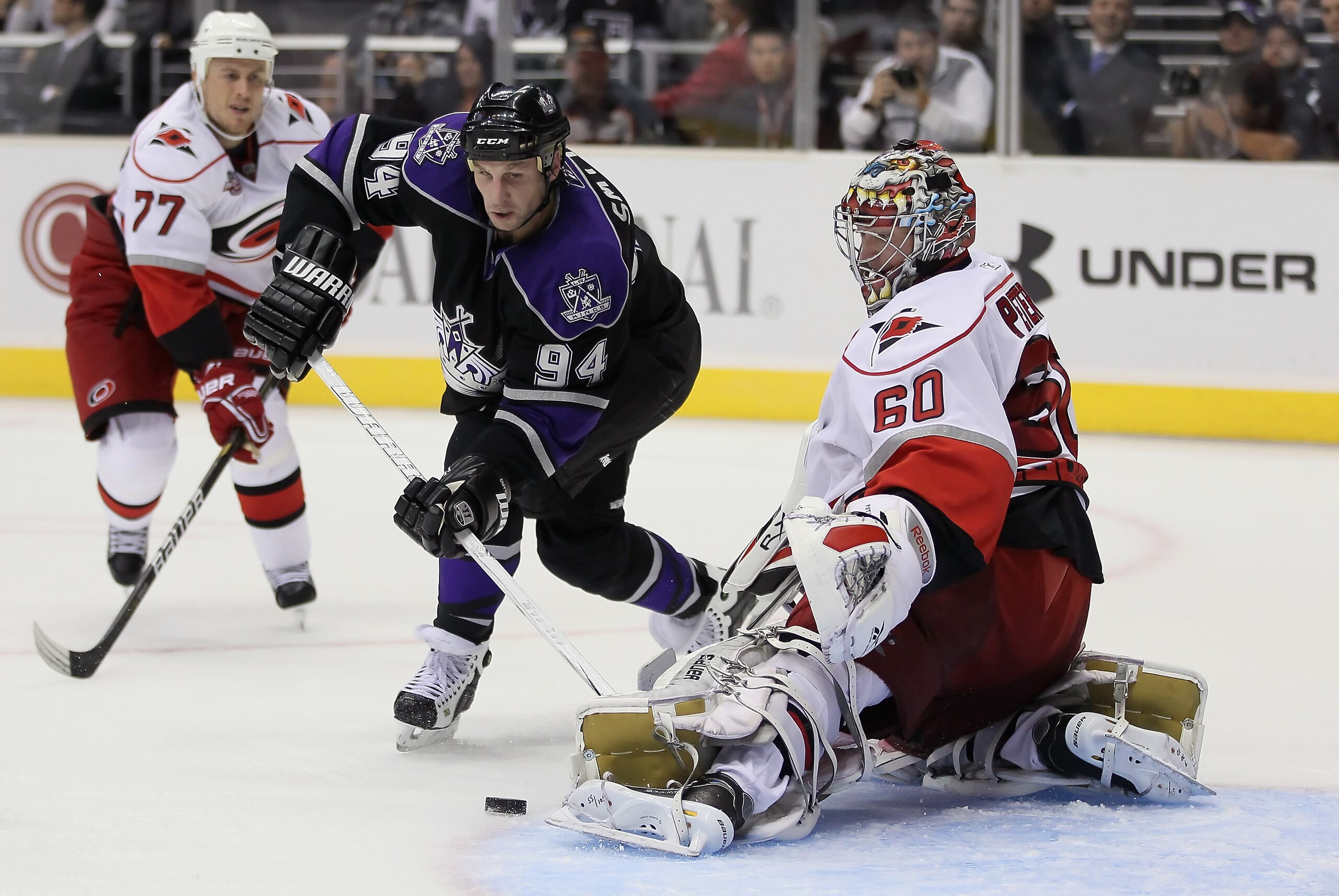 LOS ANGELES, CA - OCTOBER 20:  Goaltender Justin Peters #60 of the Carolina Hurricanes makes a kick save on a shot by Ryan Smyth #94 of the Los Angeles Kings during the second period at Staples Center on October 20, 2010 in Los Angeles, California.  (Phot