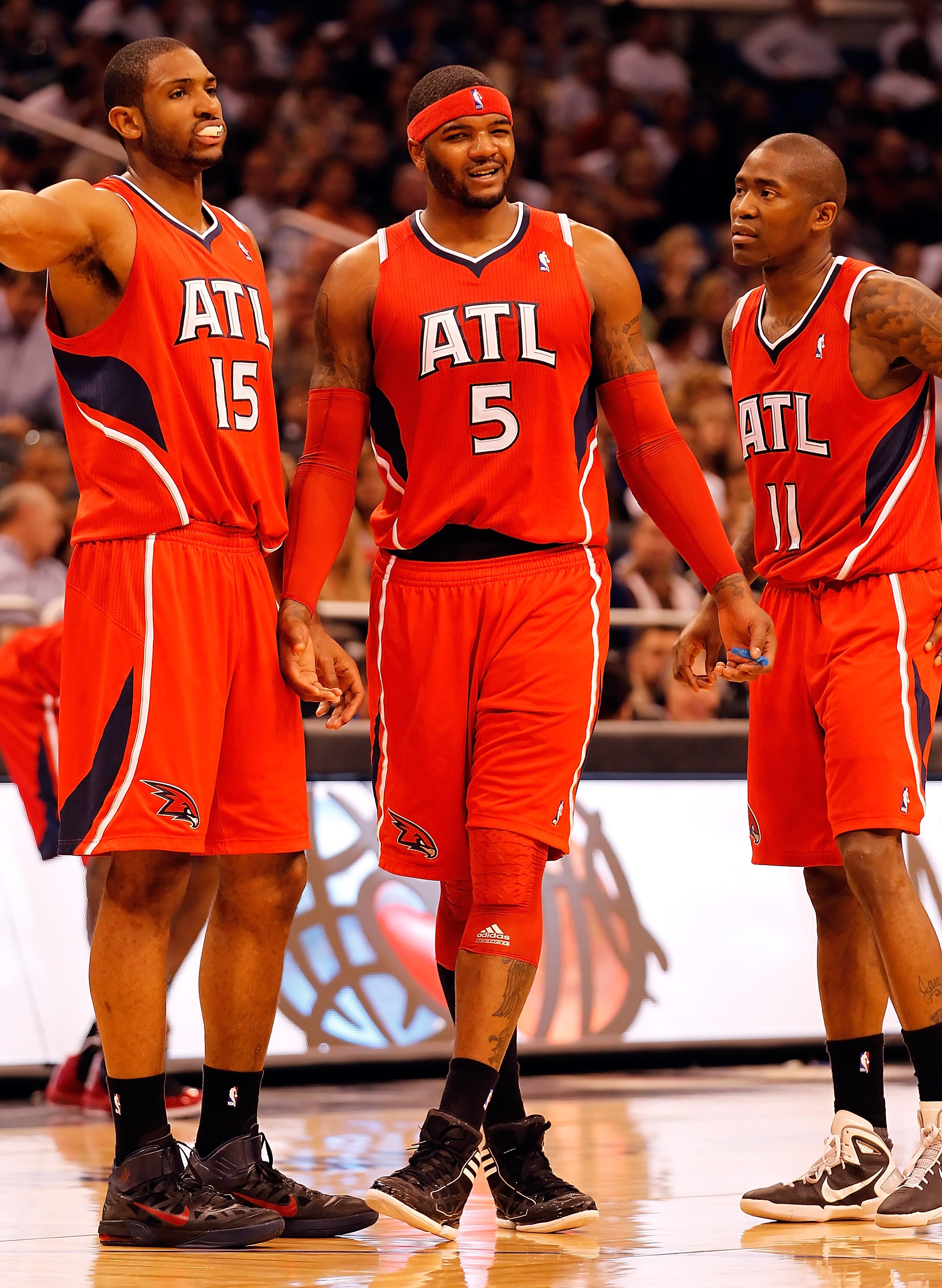 ORLANDO, FL - APRIL 19:  Josh Smith #5 of the Atlanta Hawks stands with Al Horford #15 and Jamal Crawford #11 after a technical foul is called on Smith against the Orlando Magic during Game Two of the Eastern Conference Quarterfinals of the 2011 NBA Playo
