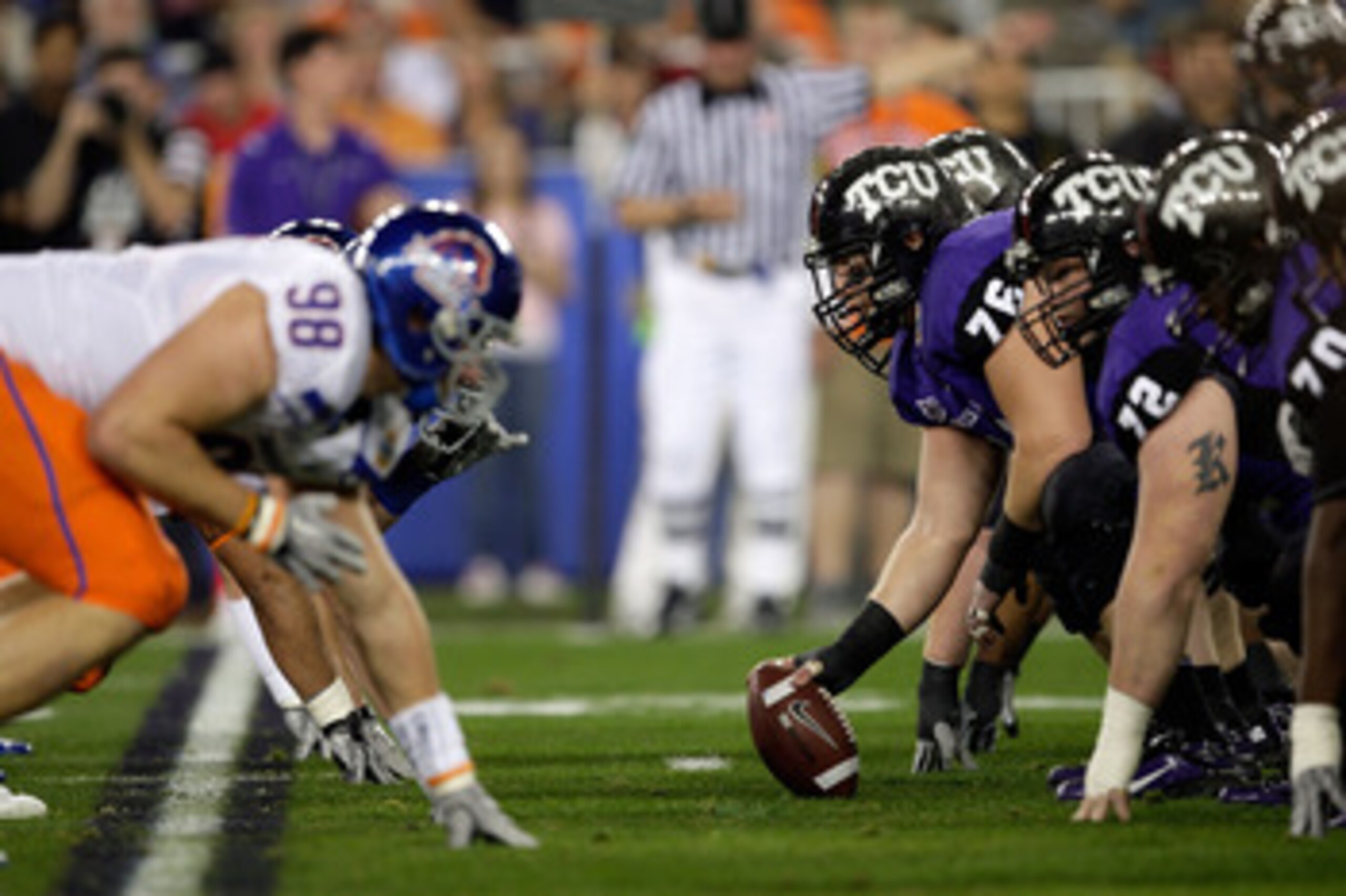 GLENDALE, AZ - JANUARY 04:  Jake Kirkpatrick #76 of the TCU Horned Frogs gets ready to hike the football in the first half against the Boise State Broncos during the Tostitos Fiesta Bowl at the Universtity of Phoenix Stadium on January 4, 2010 in Glendale