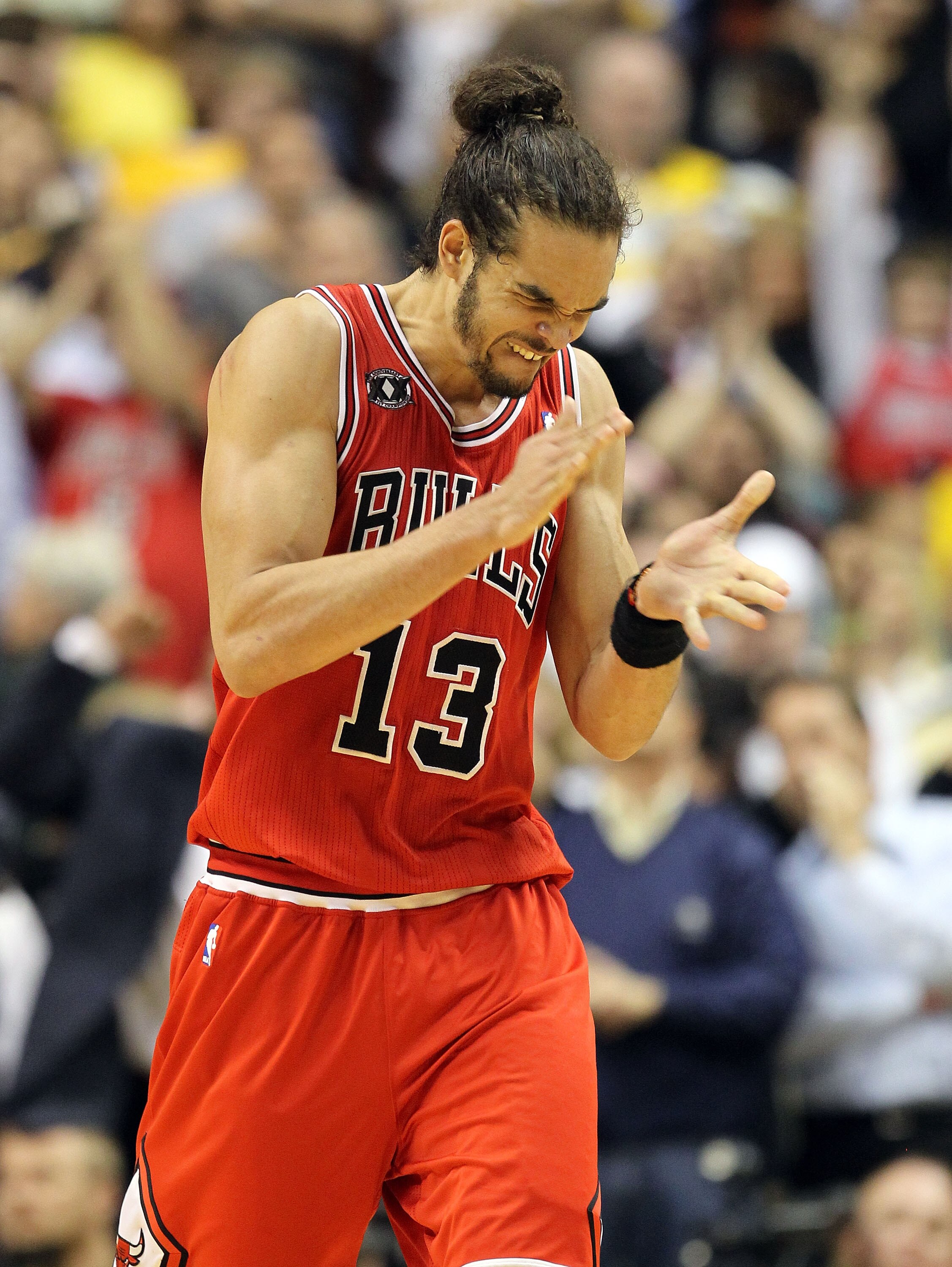INDIANAPOLIS, IN - APRIL 21:  Joakim Noah #13 of the Chicago Bulls celebrates after Derrick Rose hit the game winning shot against the Indiana Pacers in Game three of the Eastern Conference Quarterfinals in the 2011 NBA Playoffs on April 21, 2011  at Cons