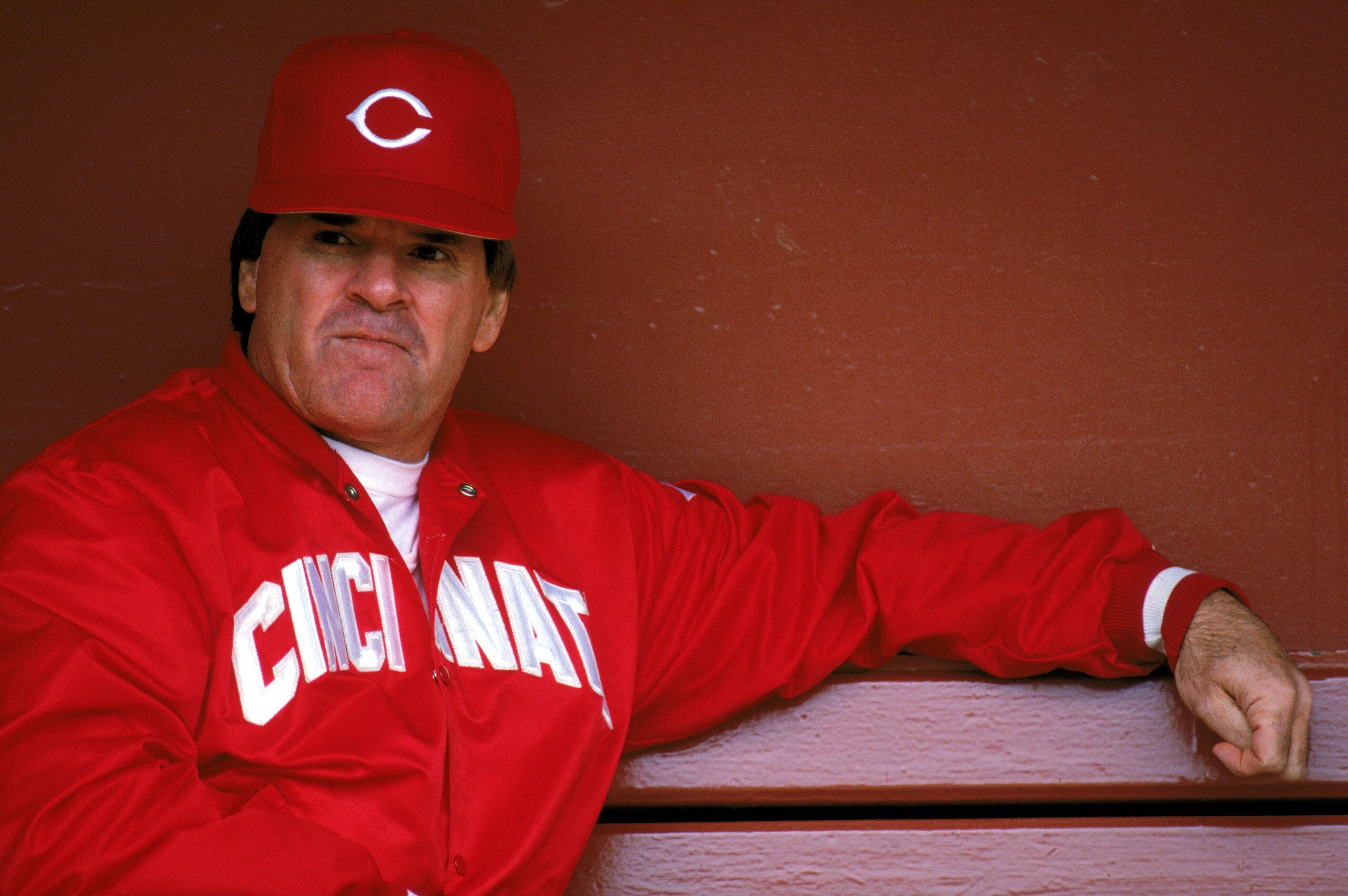 SAN FRANCISCO - 1989:  Manager Pete Rose #14 of the Cincinnati Reds sits in the dugout during the game against the San Francisco Giants at Candlestick Park during the 1989 MLB season in San Francisco, California.  (Photo by Otto Greule Jr./Getty Images)