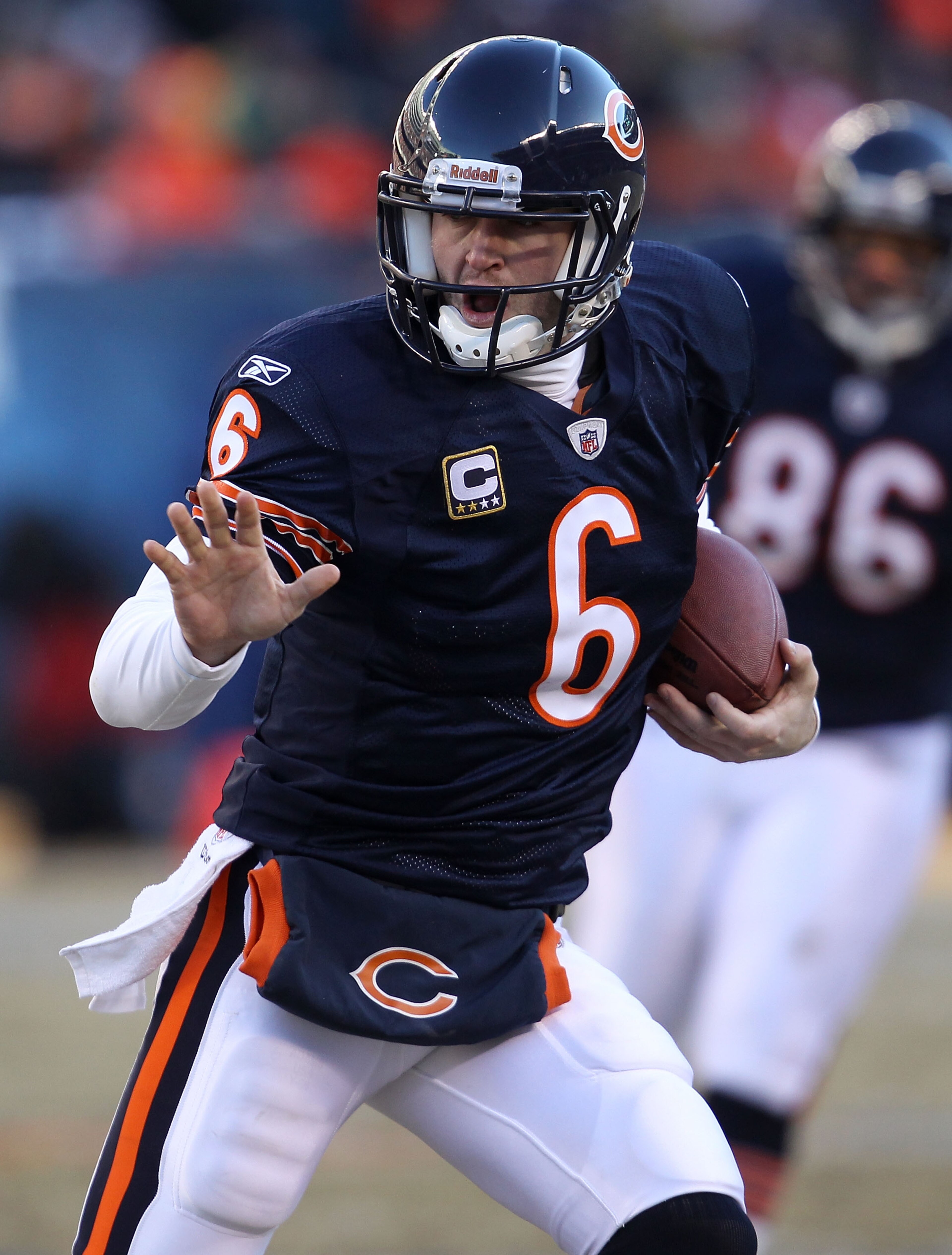 CHICAGO, IL - JANUARY 23:  Quarterback Jay Cutler #6 of the Chicago Bears runs the ball ahead of Clay Matthews #52 of the Green Bay Packers in the second quarter of the NFC Championship Game at Soldier Field on January 23, 2011 in Chicago, Illinois.  (Pho