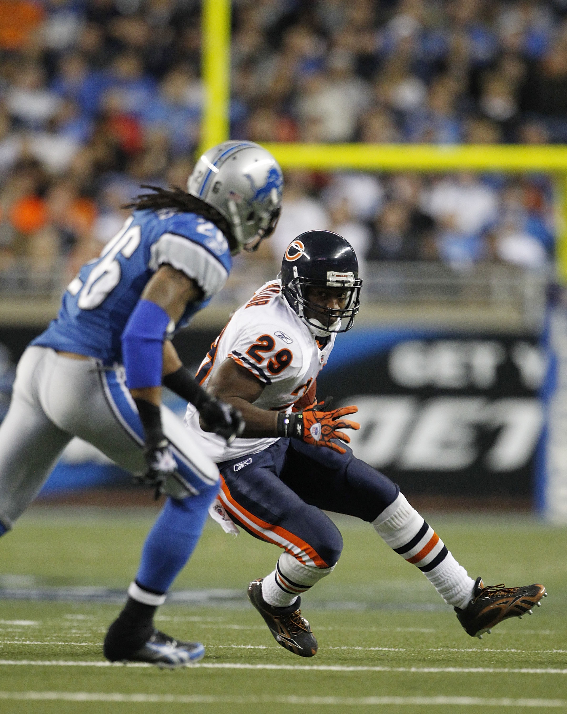 DETROIT - DECEMBER 05: Chester Taylor #29 of the Chicago Bears runs for a first down as Louis Delmas #26 of the Detroit Lions defends during the game at Ford Field on December 5, 2010 in Detroit, Michigan. The Bears defeated the Lions 24-20.  (Photo by Le