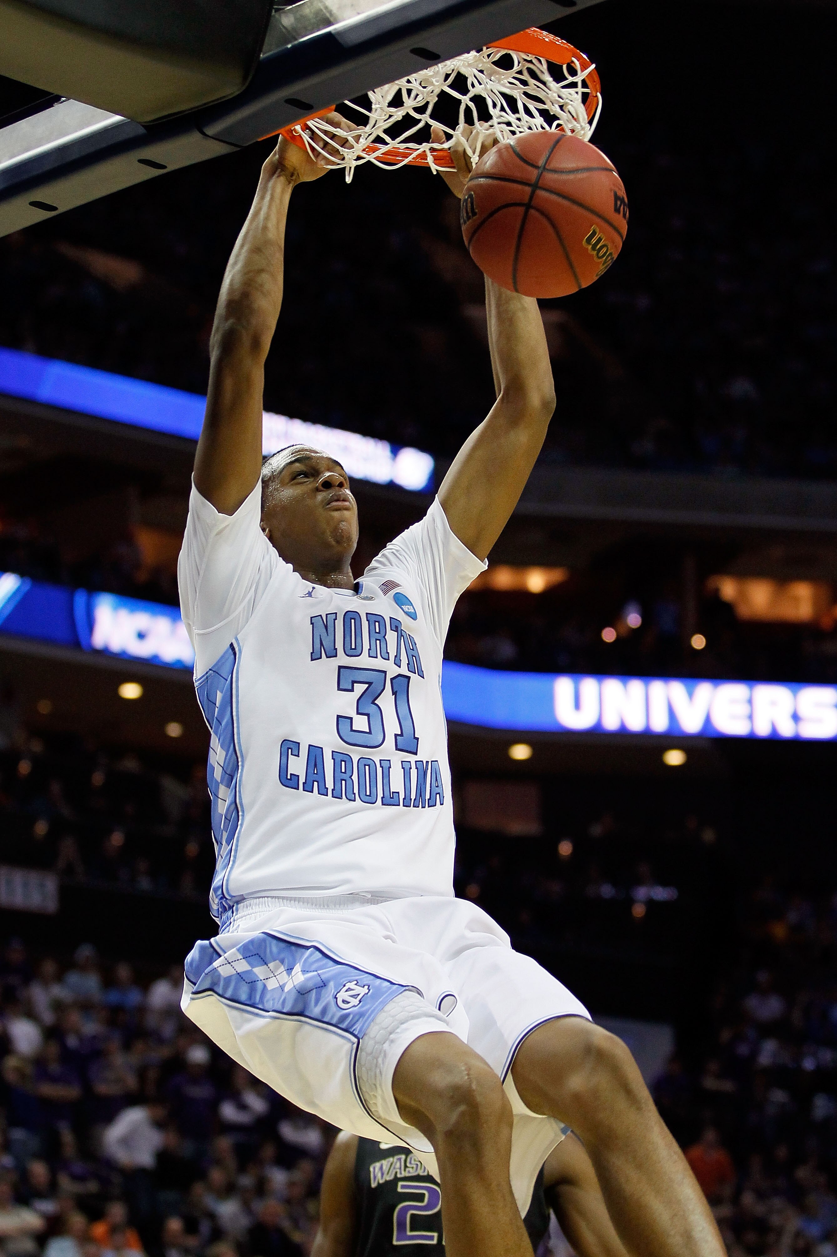 CHARLOTTE, NC - MARCH 20:  John Henson #31 of the North Carolina Tar Heels dunks the ball in the second half while taking on the Washington Huskies during the third round of the 2011 NCAA men's basketball tournament at Time Warner Cable Arena on March 20,