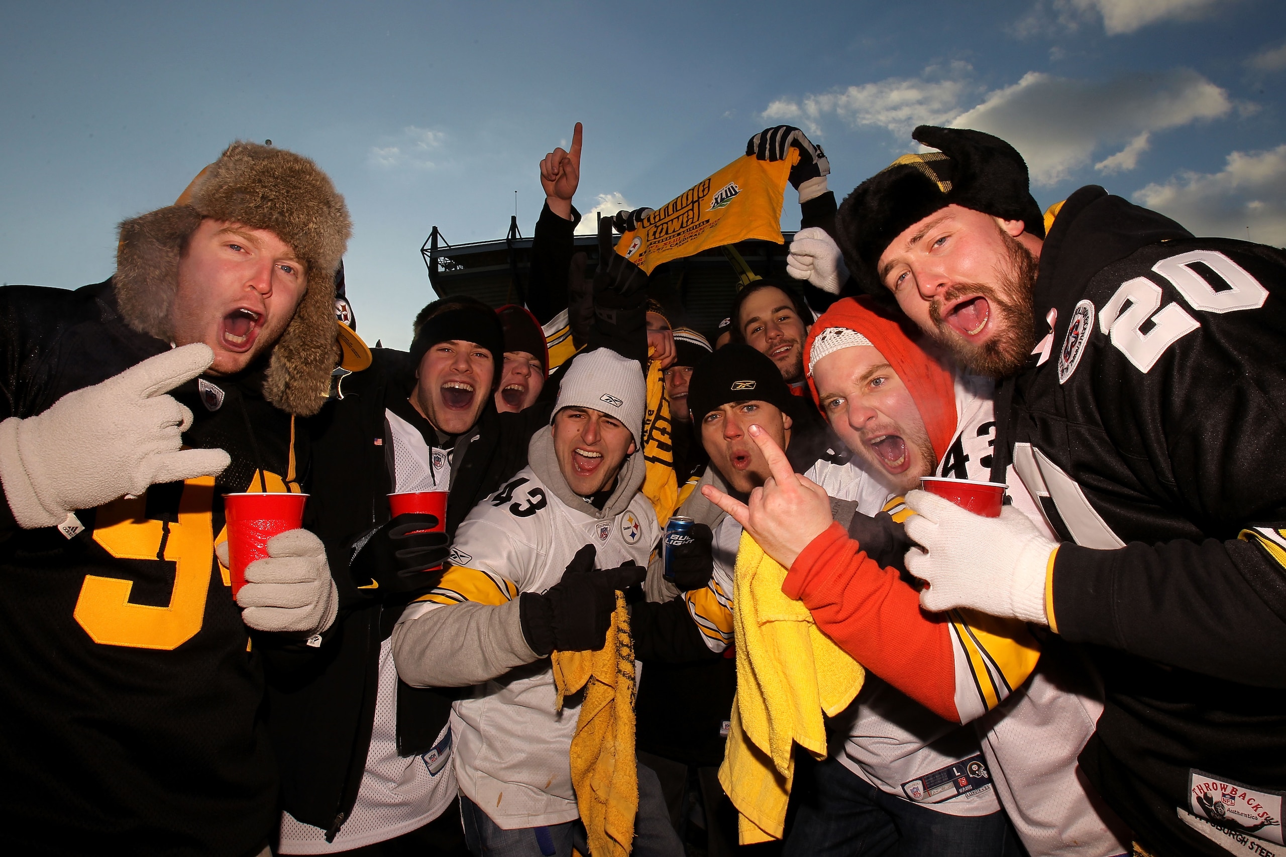 PITTSBURGH, PA - JANUARY 23: Fans of the Pittsburgh Steelers pose for a photo as they tailgate outside the stadium prior to the 2011 AFC Championship game against the New York Jets at Heinz Field on January 23, 2011 in Pittsburgh, Pennsylvania. (Photo b PITTSBURGH, PA - JANUARY 23: Fans of the Pittsburgh Steelers pose for a photo as they tailgate outside the stadium prior to the 2011 AFC Championship game against the New York Jets at Heinz Field on January 23, 2011 in Pittsburgh, Pennsylvania. (Photo b