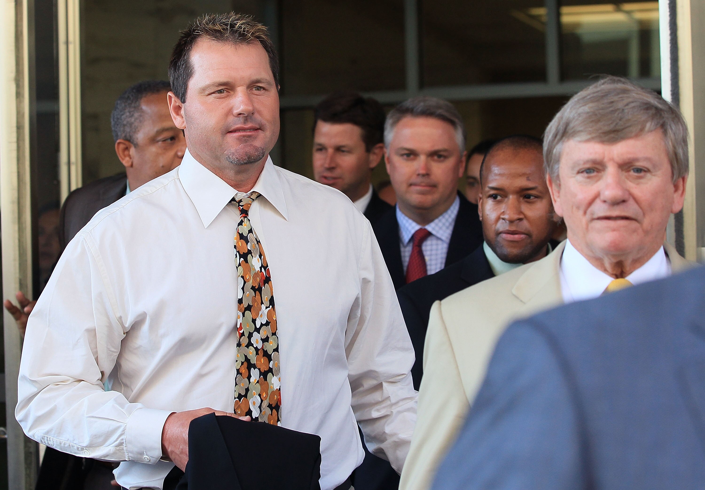 WASHINGTON - AUGUST 30:  Baseball pitching star Roger Clemens (L) walks out of the U.S. District Court after his arraignment, on August 30, 2010 in Washington, DC. Clemens who plead not-guilty was charged with making false statements, perjury and obstruct