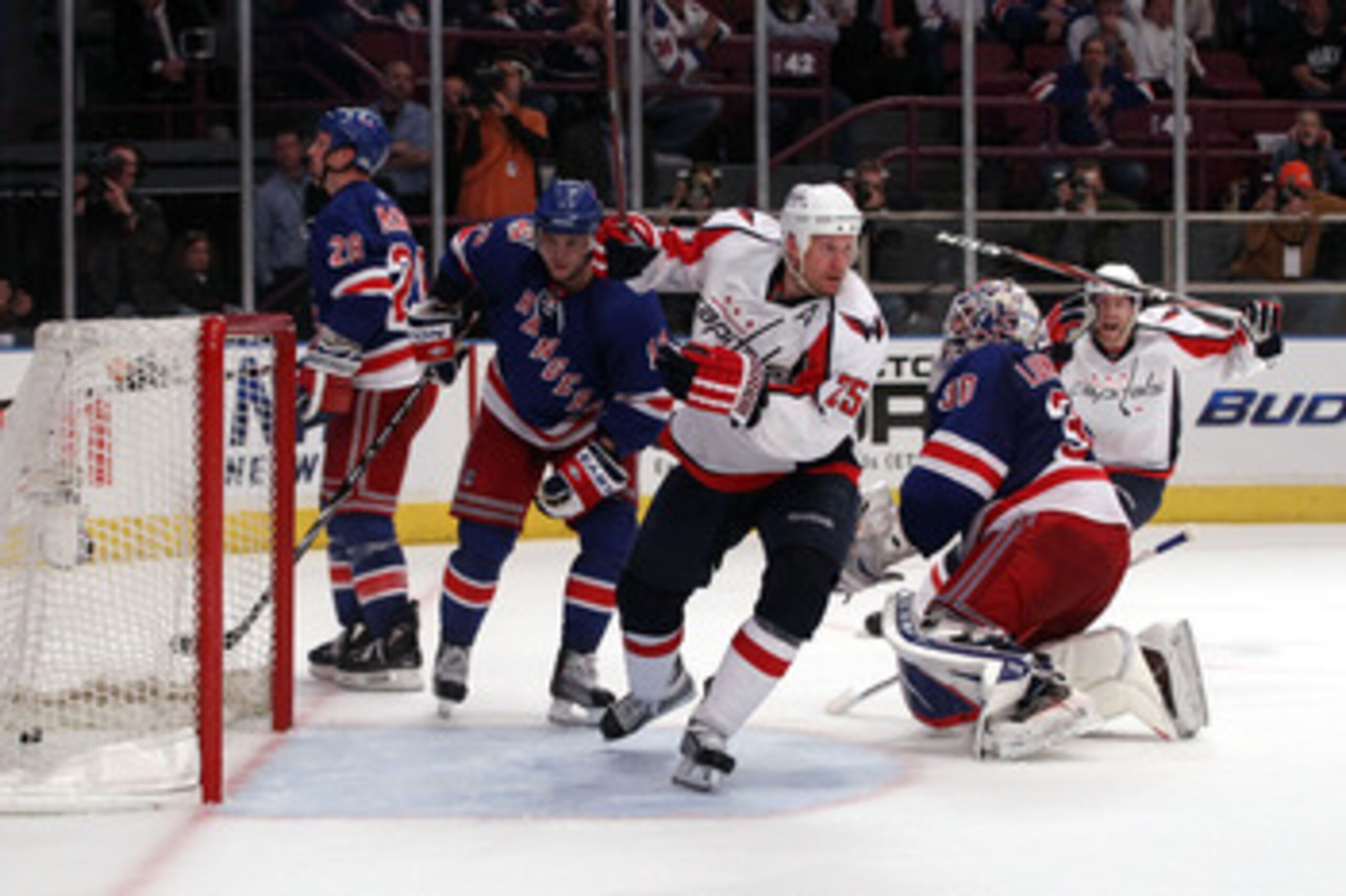 NEW YORK, NY - APRIL 20:  Jason Chimera #25 of the Washington Capitals celebrates after he scored the game-winning goal in the second overtime period to give the Capitals a 4-3 win against Marian Gaborik #10 (2nd L) and goalie Henrik Lundqvist #30 of the