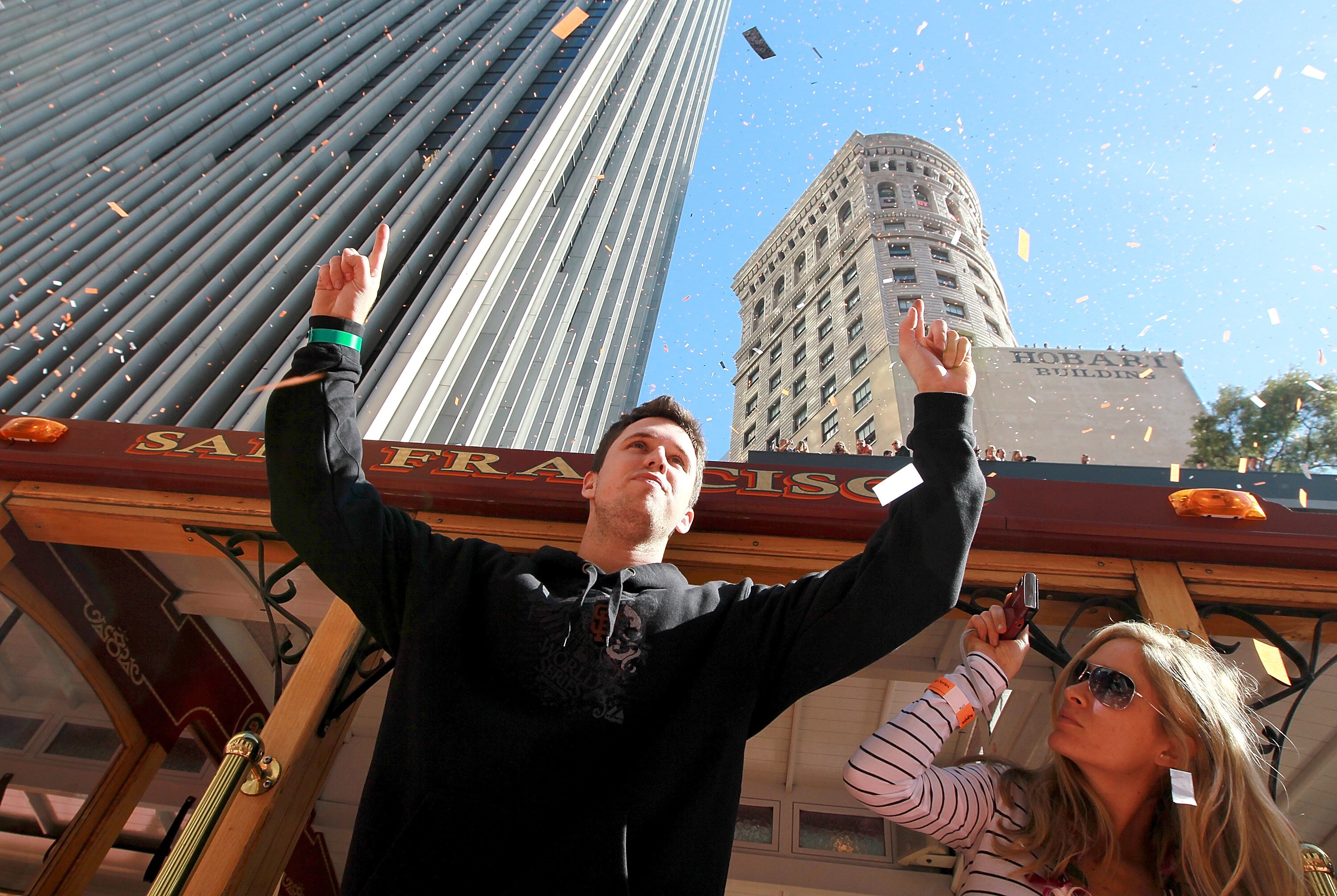 SAN FRANCISCO - NOVEMBER 03:  Buster Posey of the San Francisco Giants celebrates during the Giants' vicotry parade on November 3, 2010 in San Francisco, California. Thousands of Giants fans lined the streets of San Francisco to watch the San Francisco Gi