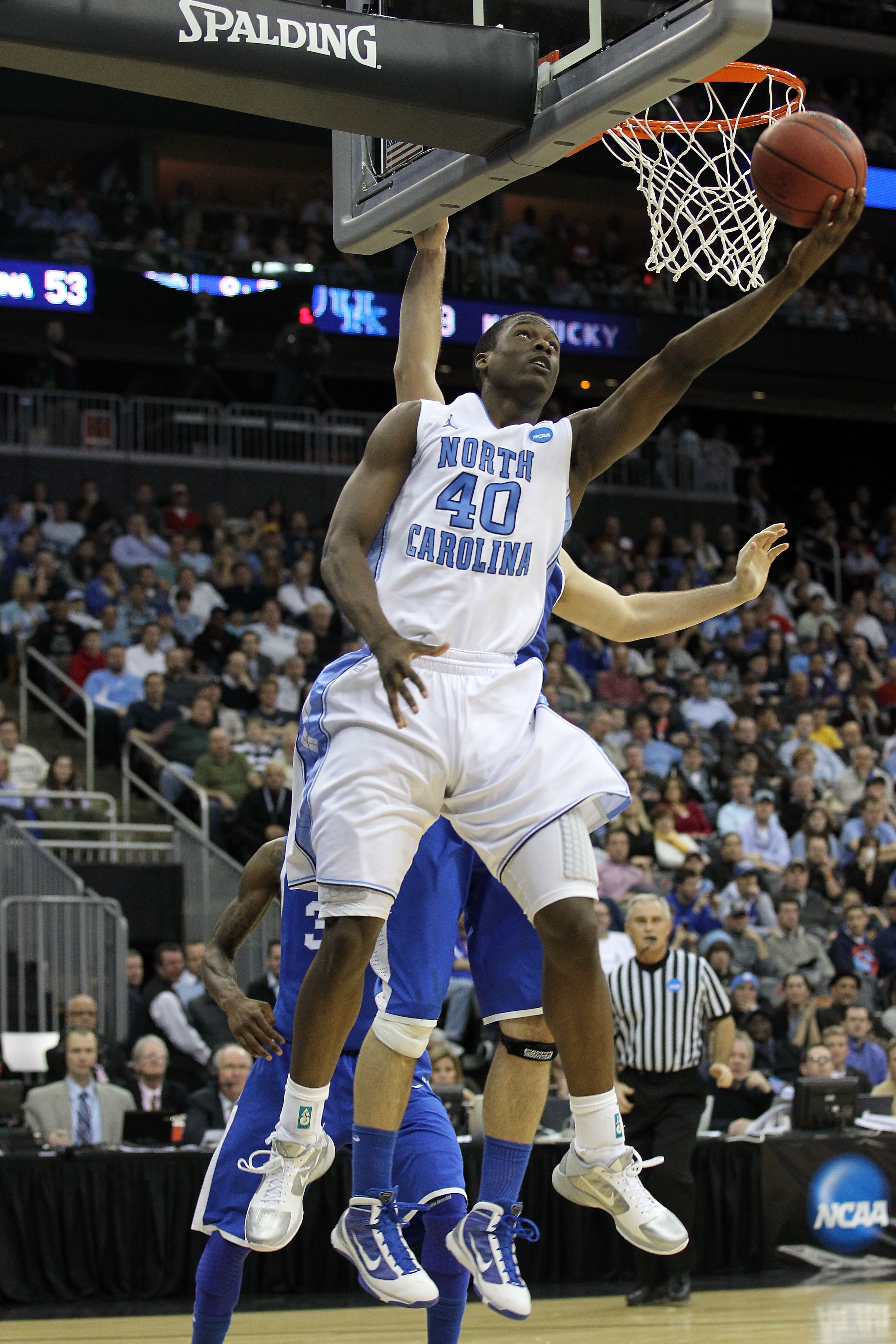 NEWARK, NJ - MARCH 27:  Harrison Barnes #40 of the North Carolina Tar Heels in action against Josh Harrellson #55 of the Kentucky Wildcats during the east regional final of the 2011 NCAA men's basketball tournament at Prudential Center on March 27, 2011 i