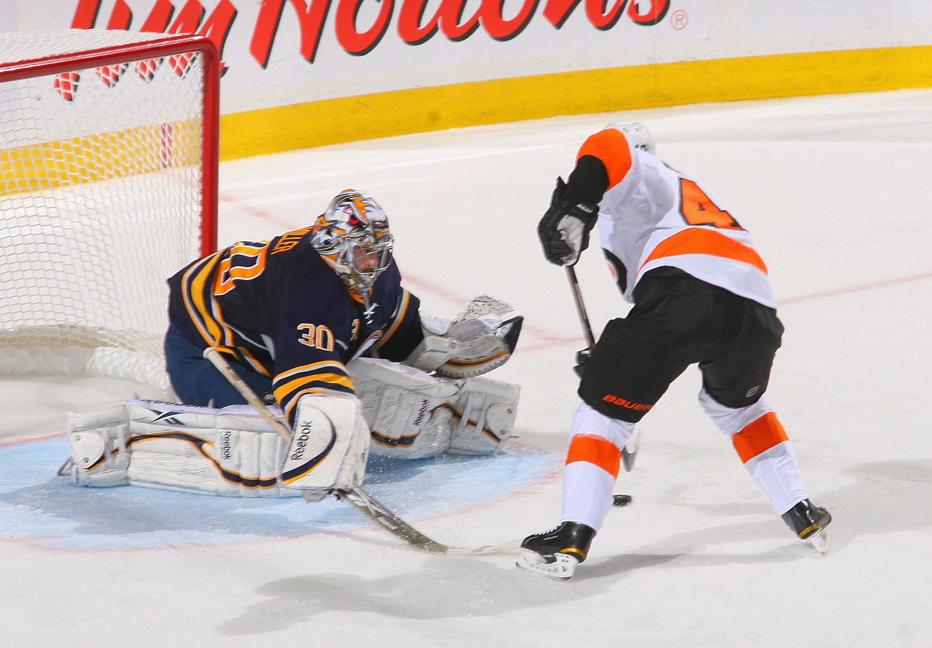 BUFFALO, NY - APRIL 20: Ryan Miller #30 of the Buffalo Sabres readies to stop Daniel Briere #48 of the Philadelphia Flyers late in the third period in Game Four of the Eastern Conference Quarterfinals during the 2011 NHL Stanley Cup Playoffs at HSBC Arena