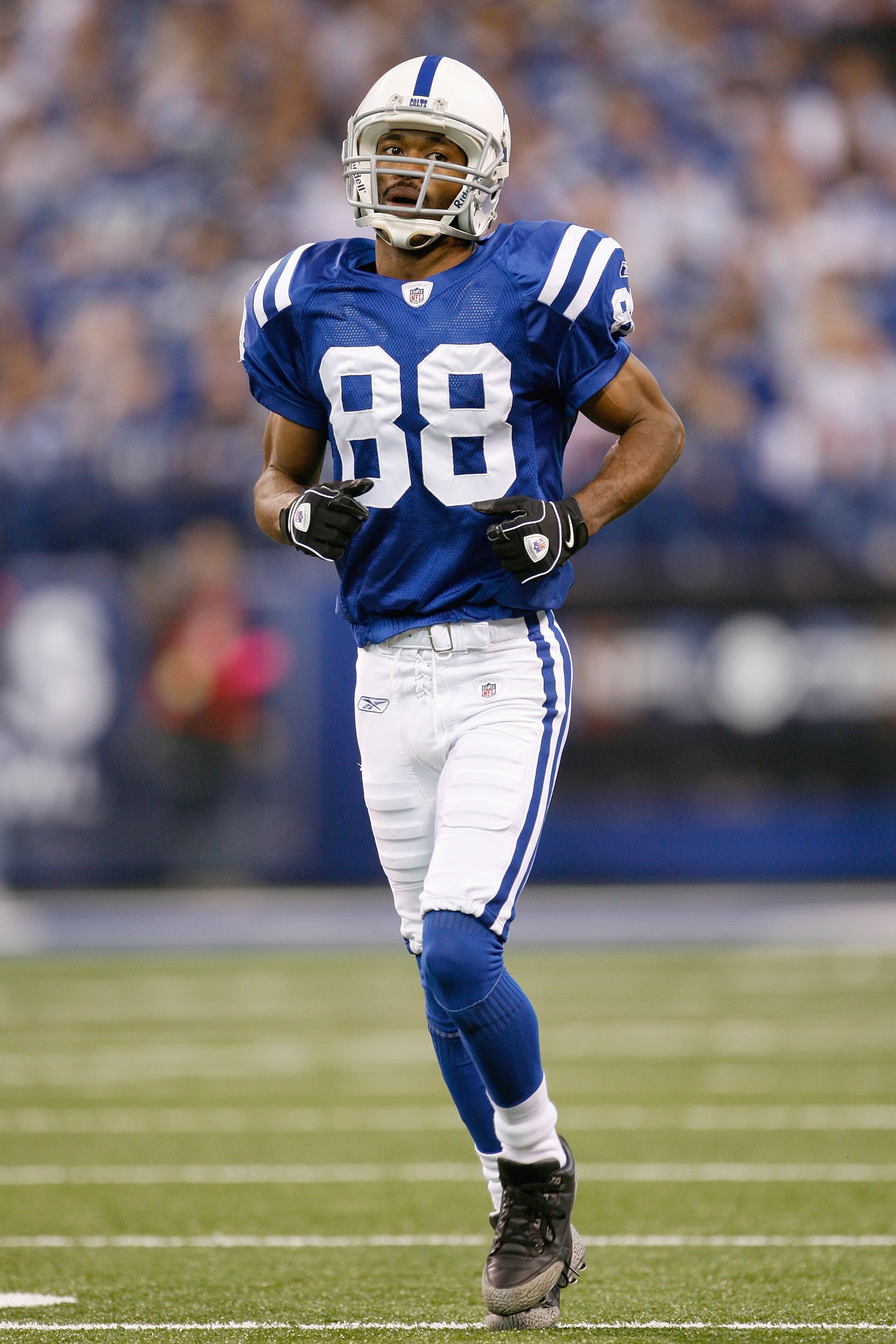 INDIANAPOLIS - DECEMBER 28:  Marvin Harrison #88 of the Indianapolis Colts jogs on the field during the game against the Tennessee Titans on December 28, 2008 at Lucas Oil Stadium in Indianapolis, Indiana. (Photo by: Jamie Squire/Getty Images)