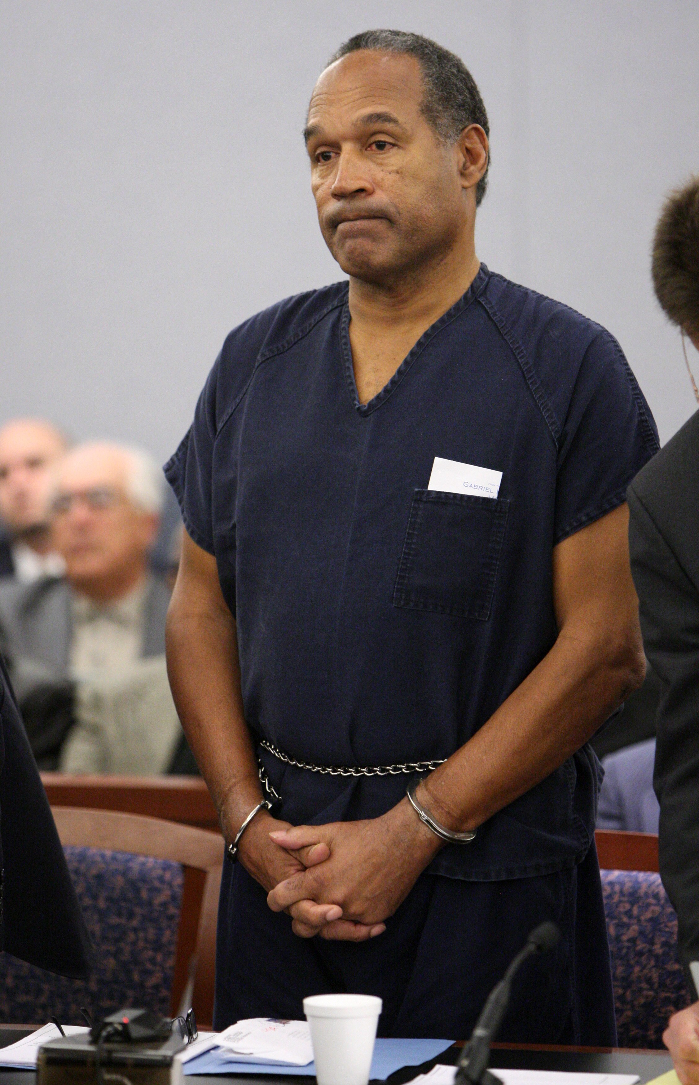LAS VEGAS - DECEMBER 5:  OJ Simpson listens as District Court Judge Jackie Glass reads his sentence at the Clark County Regional Justice Center December 5, 2008 in Las Vegas, Nevada.  Simpson and co-defendant Clarence 'C.J.' Stewart were sentenced on 12 c