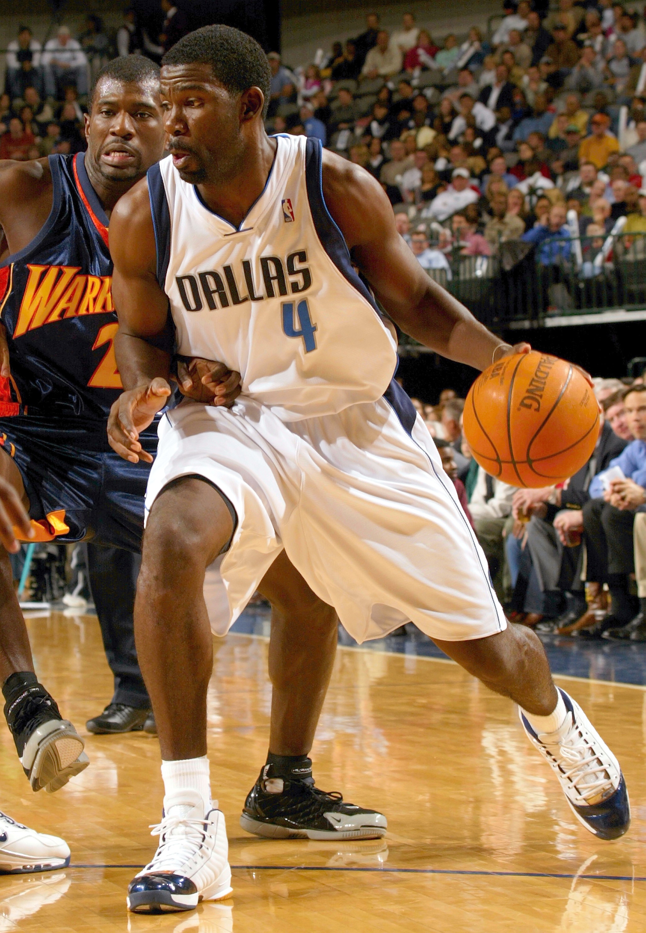 DALLAS - DECEMBER 14: Forward Michael Finley #4 of the Dallas Mavericks moves the ball past Jason Richardson #23 of the Golden State Warriors on December 14, 2004 at the American Airlines Center in Dallas, Texas.   NOTE TO USER:  User expressly acknowledg