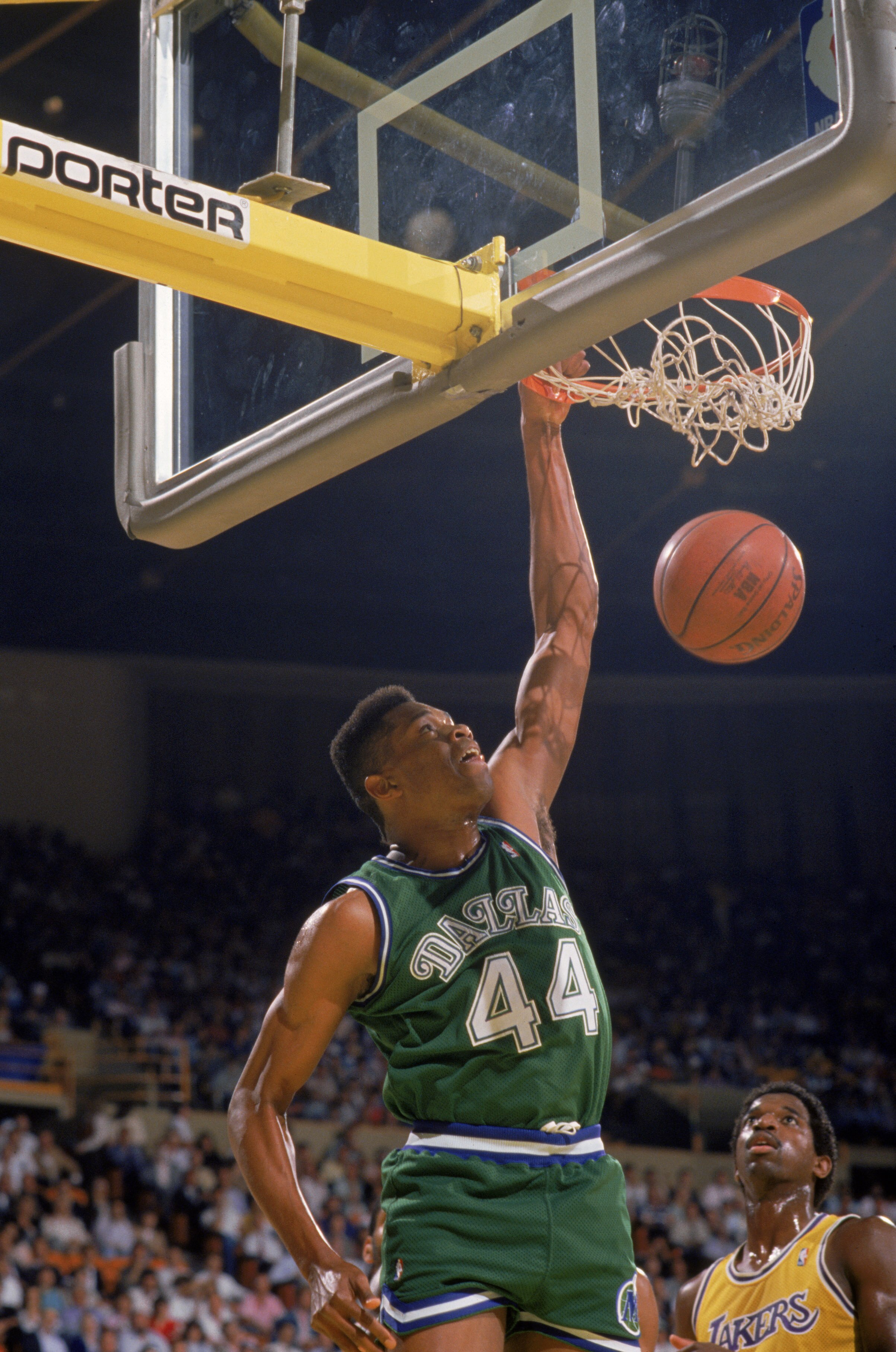 LOS ANGELES - 1987:  Sam Perkins #44 of the Dallas Mavericks dunks the ball during the NBA game against the Los Angeles Lakers at the Great Western Forum in Los Angeles, California in 1987. NOTE TO USER: User expressly acknowledges and agrees that, by dow