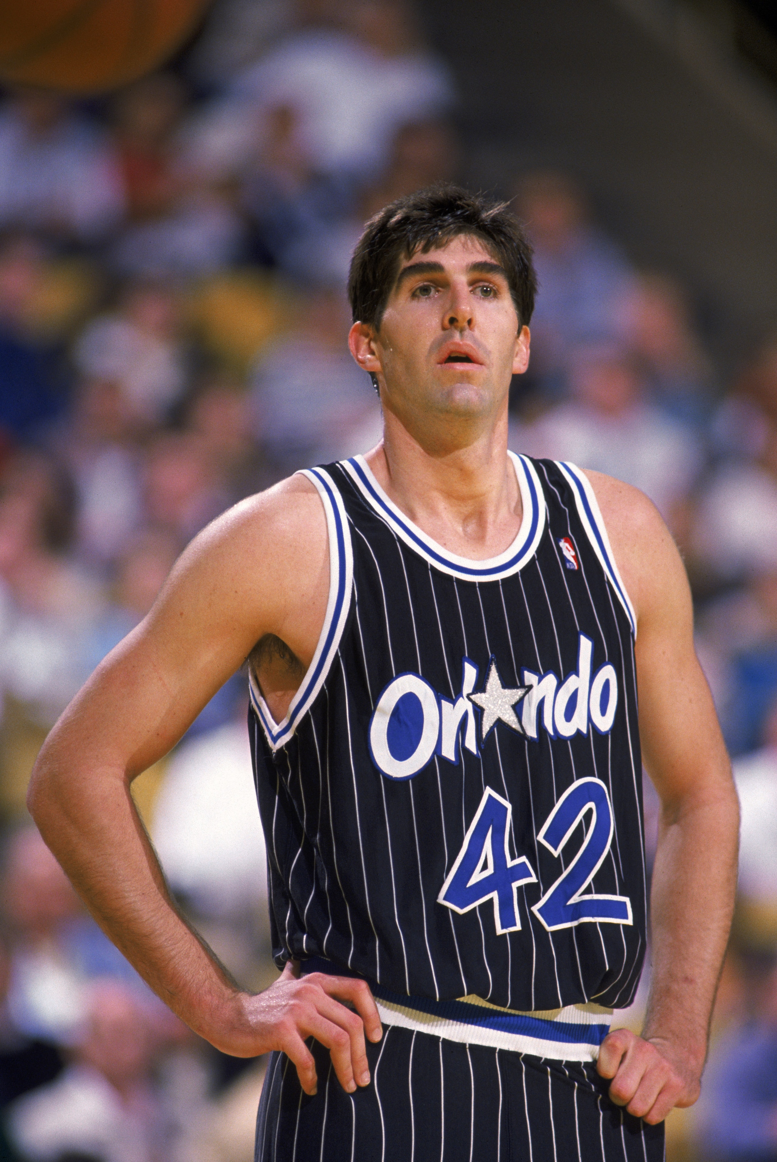 LOS ANGELES - 1990:  Mark Acres #42 of the Orlando Magic stands on the court during an NBA game against the Los Angeles Lakers at the Great Western Forum in Los Angeles, California in 1990. NOTE TO USER: User expressly acknowledges and agrees that, by dow