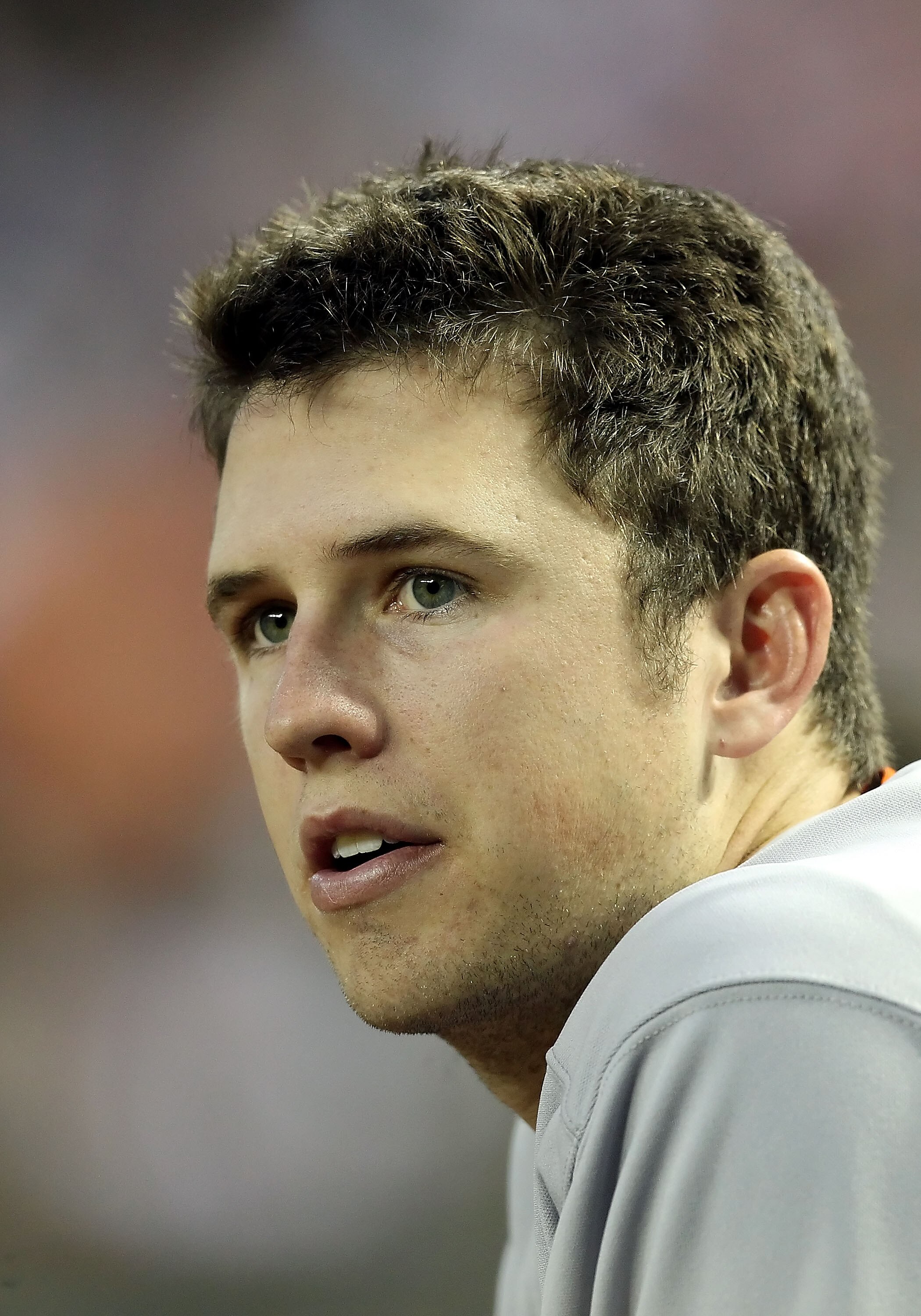 PHOENIX, AZ - APRIL 16:  Buster Posey #28 of the San Francisco Giants watches from the dugout during the Major League Baseball game against the Arizona Diamondbacks at Chase Field on April 16, 2011 in Phoenix, Arizona.  The Giants defeated the Diamondback