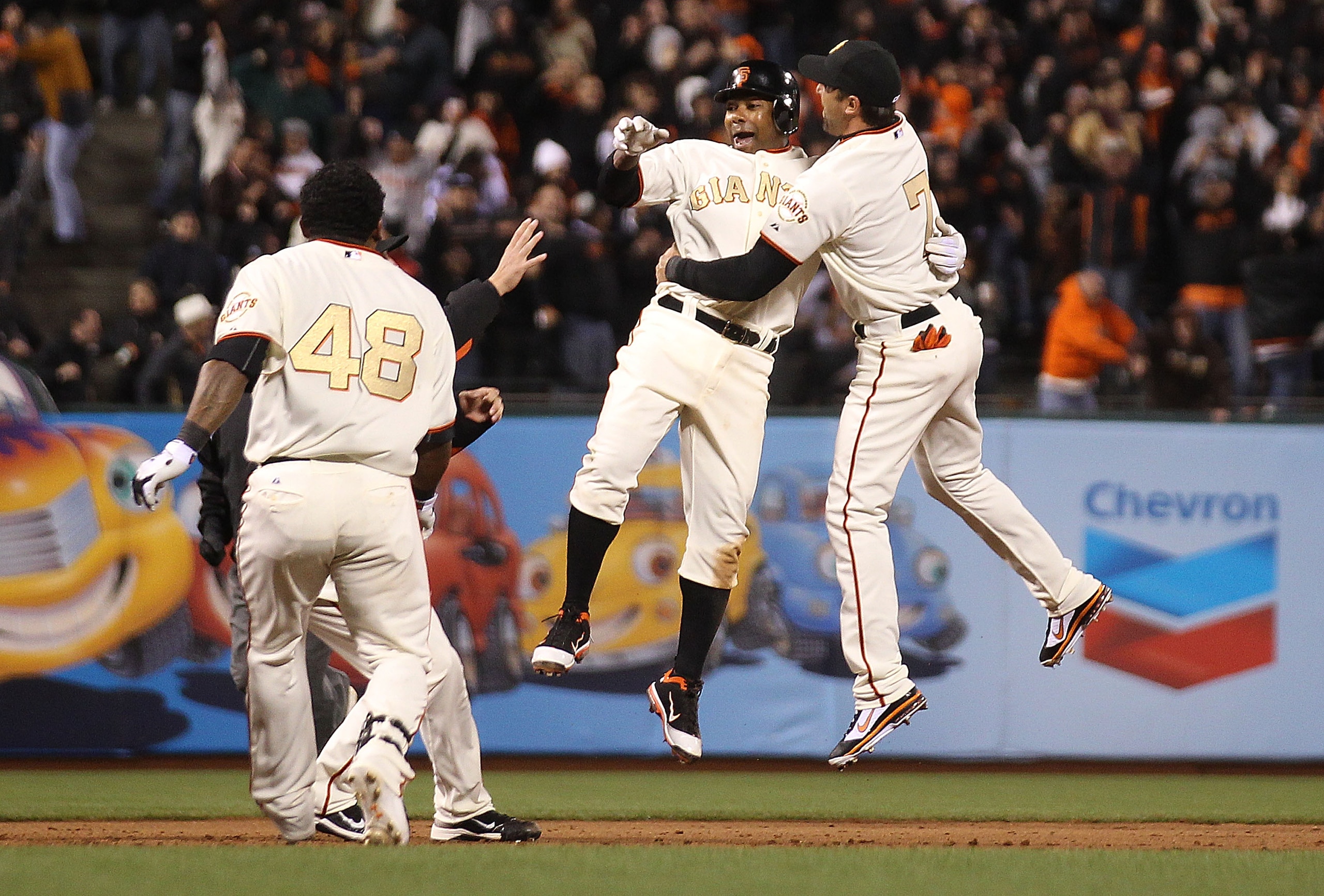 SAN FRANCISCO, CA - APRIL 09:  Miguel Tejada #10 of the San Francisco Giants celebrates with Mark DeRosa #7 after the game winning hit in the ninth inning against the St. Louis Cardinals at AT&T Park on April 9, 2011 in San Francisco, California.  (Photo 