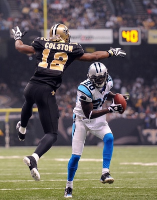 NEW ORLEANS - NOVEMBER 08:  Cornerback Chris Gamble #20 of the Carolina Panthers intercepts a pass intended for Marques Colston #12 of the New Orleans Saints at Louisiana Superdome on November 8, 2009 in New Orleans, Louisiana.  (Photo by Ronald Martinez/