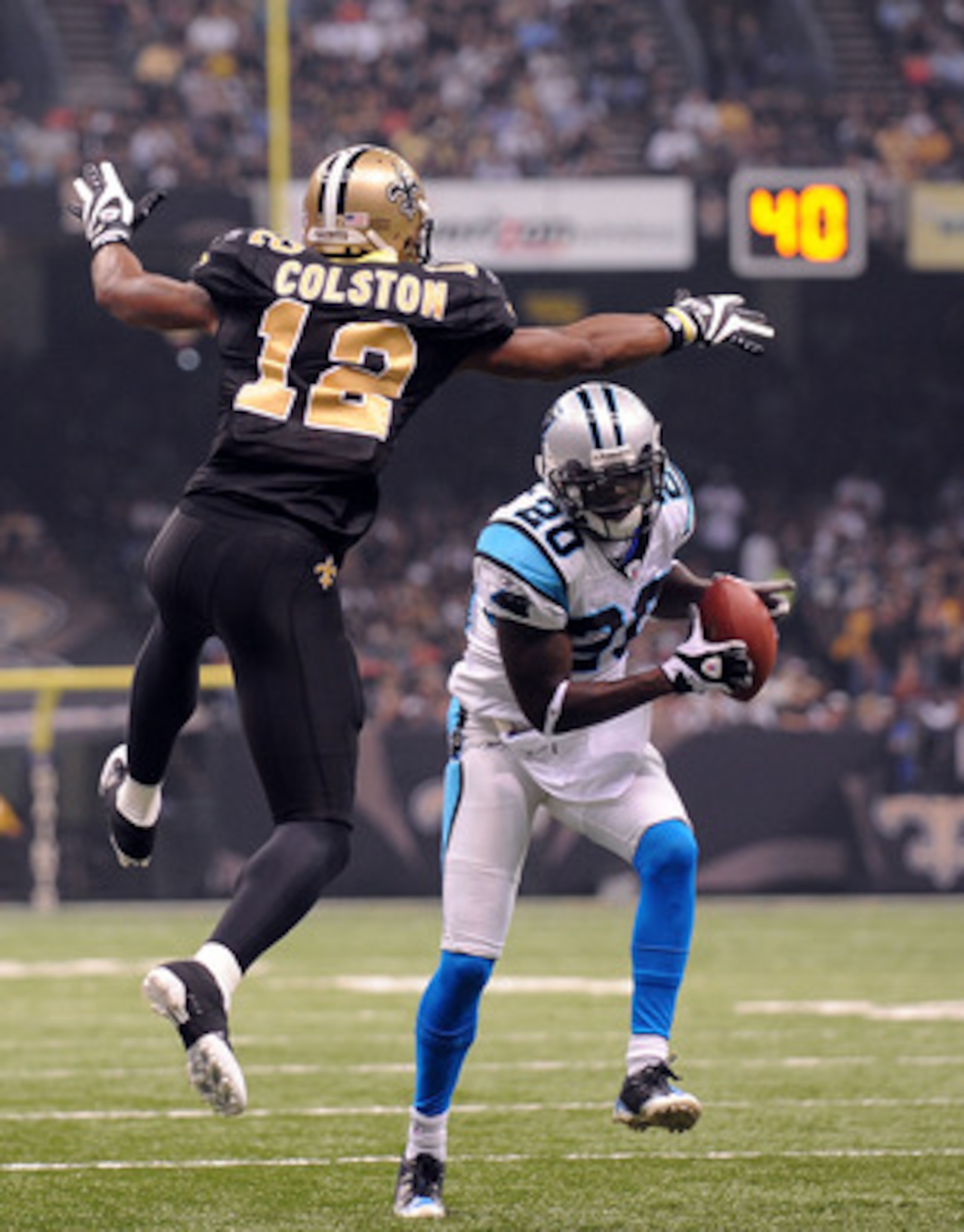 NEW ORLEANS - NOVEMBER 08: Cornerback Chris Gamble #20 of the Carolina Panthers intercepts a pass intended for Marques Colston #12 of the New Orleans Saints at Louisiana Superdome on November 8, 2009 in New Orleans, Louisiana. (Photo by Ronald Martinez/ NEW ORLEANS - NOVEMBER 08: Cornerback Chris Gamble #20 of the Carolina Panthers intercepts a pass intended for Marques Colston #12 of the New Orleans Saints at Louisiana Superdome on November 8, 2009 in New Orleans, Louisiana. (Photo by Ronald Martinez/