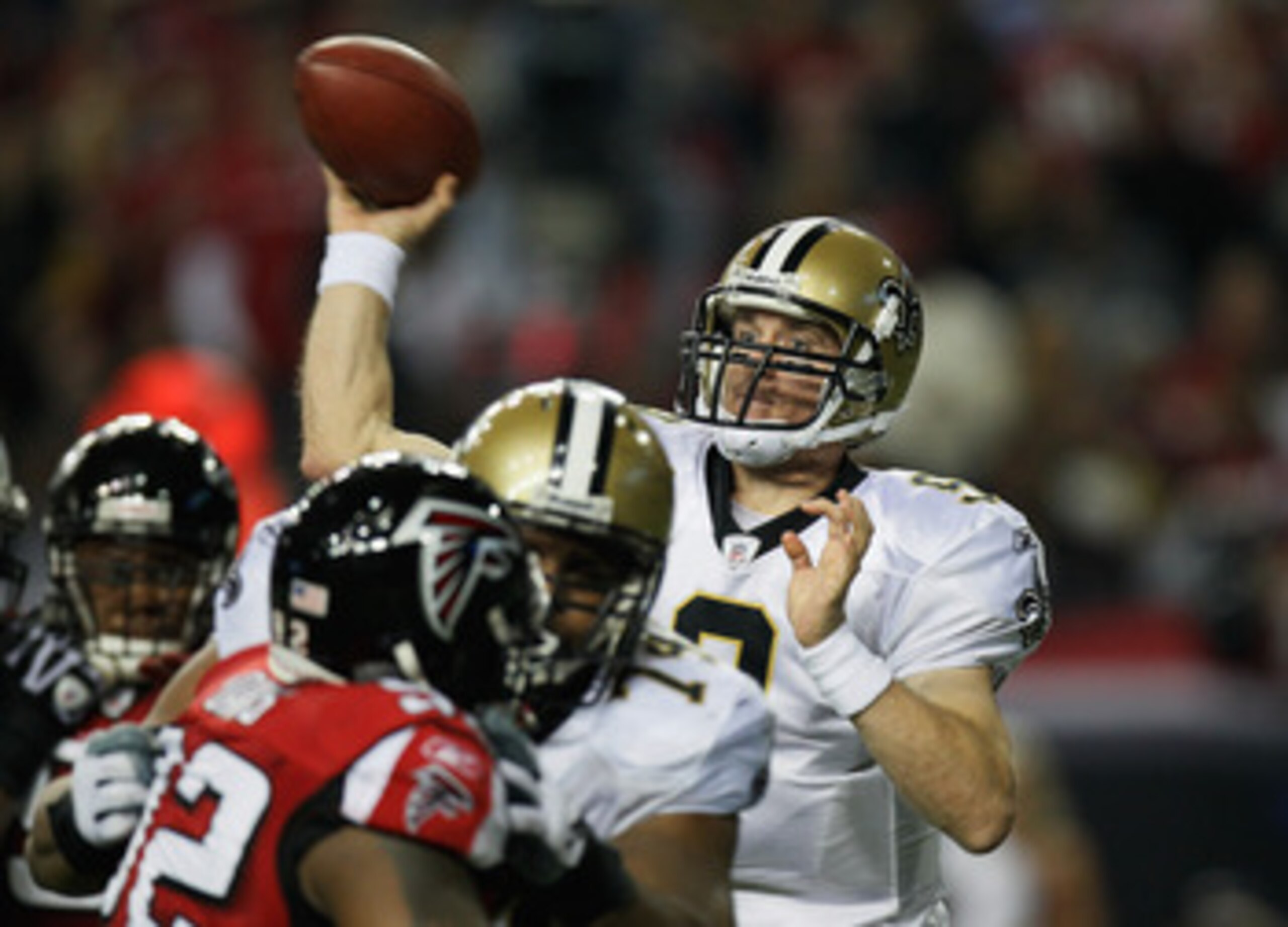 ATLANTA, GA - DECEMBER 27: Quarterback Drew Brees #9 of the New Orleans Saints looks upfield to pass in the first half during the game against the Atlanta Falcons at the Georgia Dome on December 27, 2010 in Atlanta, Georgia. (Photo by Kevin C. Cox/Getty ATLANTA, GA - DECEMBER 27: Quarterback Drew Brees #9 of the New Orleans Saints looks upfield to pass in the first half during the game against the Atlanta Falcons at the Georgia Dome on December 27, 2010 in Atlanta, Georgia. (Photo by Kevin C. Cox/Getty