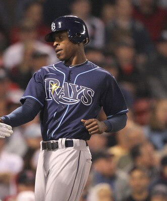 BOSTON, MA - APRIL 11:  B.J. Upton #2 of the Tampa Bay Rays scores in the second inning against the Boston Red Sox at Fenway Park April 11, 2011 in Boston, Massachusetts. (Photo by Jim Rogash/Getty Images)
