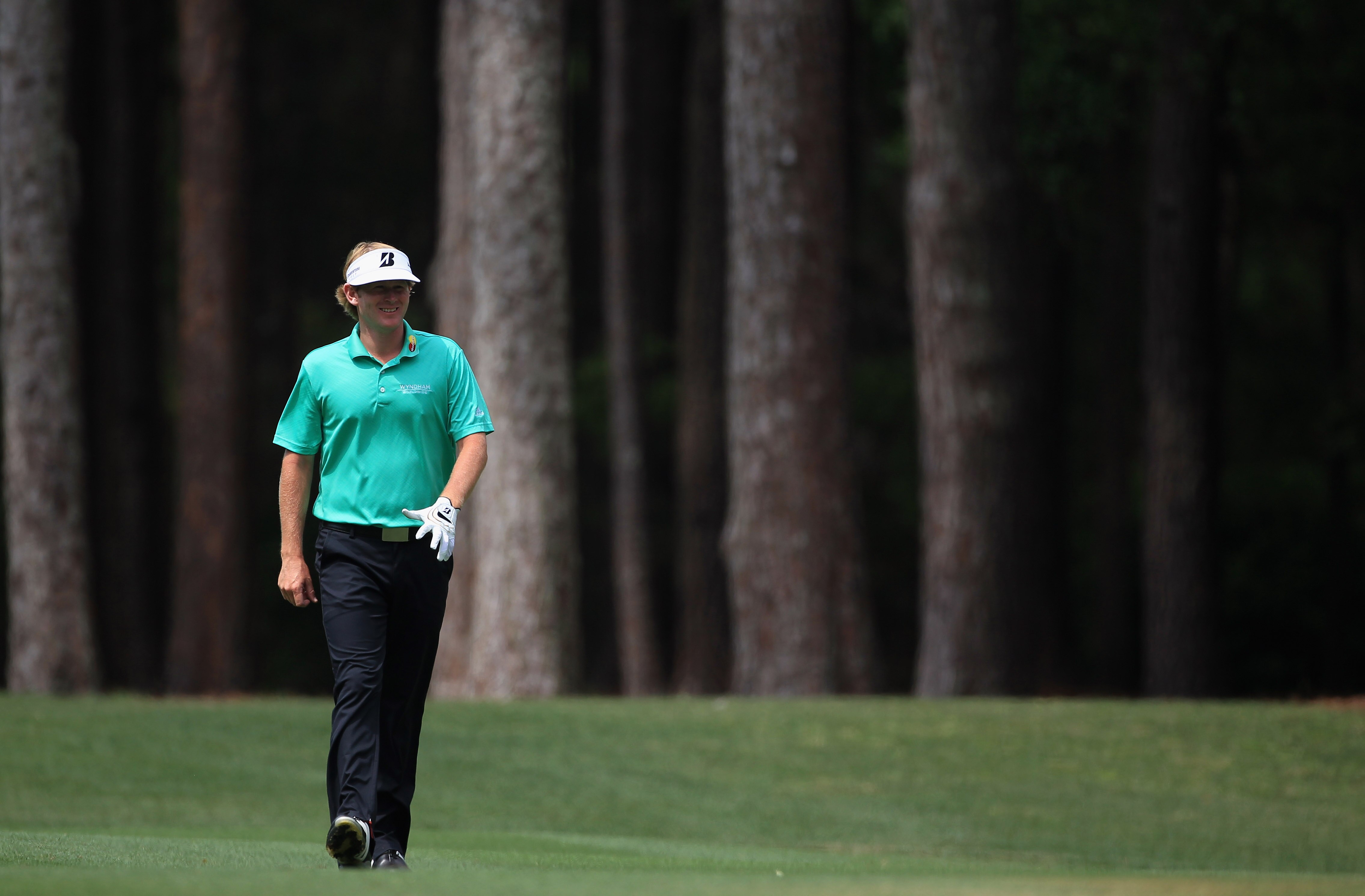 HILTON HEAD ISLAND, SC - APRIL 22:  Brandt Snedeker smiles as he walks down the fairway during the second round of The Heritage at Harbour Town Golf Links on April 22, 2011 in Hilton Head Island, South Carolina.  (Photo by Streeter Lecka/Getty Images)