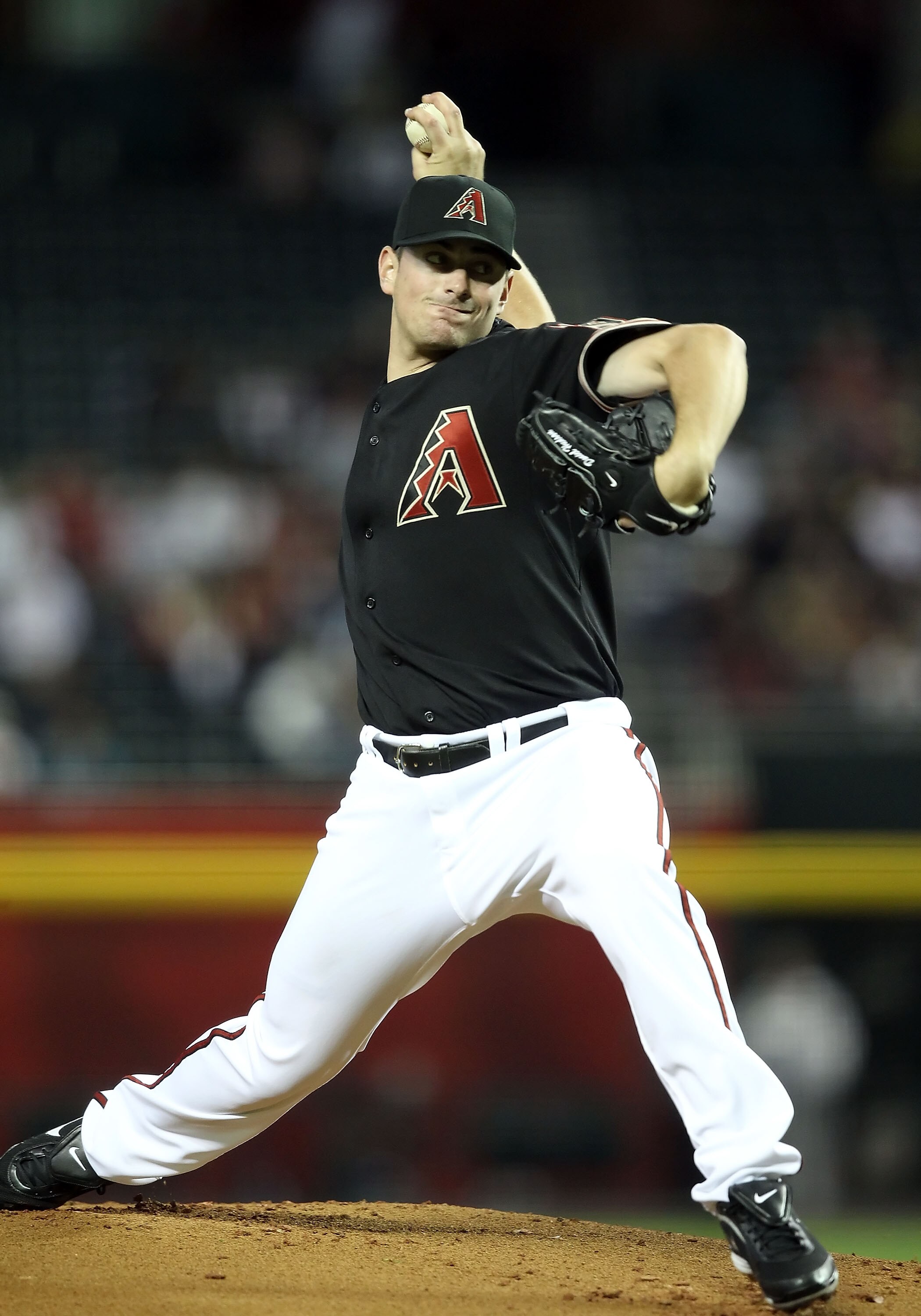 PHOENIX, AZ - APRIL 09:  Starting pitcher Daniel Hudson #41 of the Arizona Diamondbacks pitches against the Cincinnati Reds during the Major League Baseball game at Chase Field on April 9, 2011 in Phoenix, Arizona.  (Photo by Christian Petersen/Getty Imag