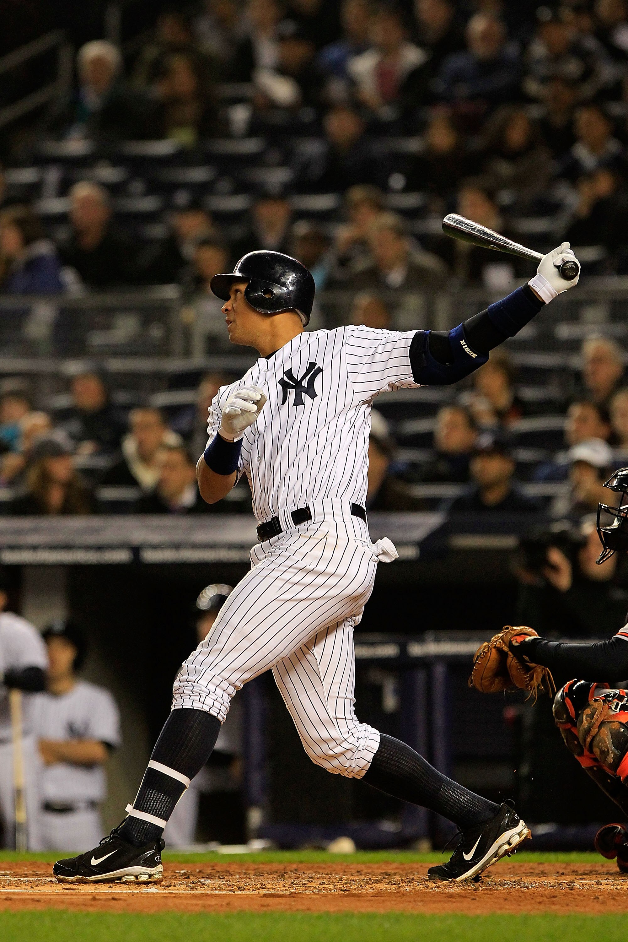 NEW YORK, NY - APRIL 13: Alex Rodriguez #13 of the New York Yankees hits a 3 run homerun in the first inning against the Baltimore Orioles at Yankee Stadium on April 13, 2011 in the Bronx borough of New York City.  (Photo by Chris Trotman/Getty Images)