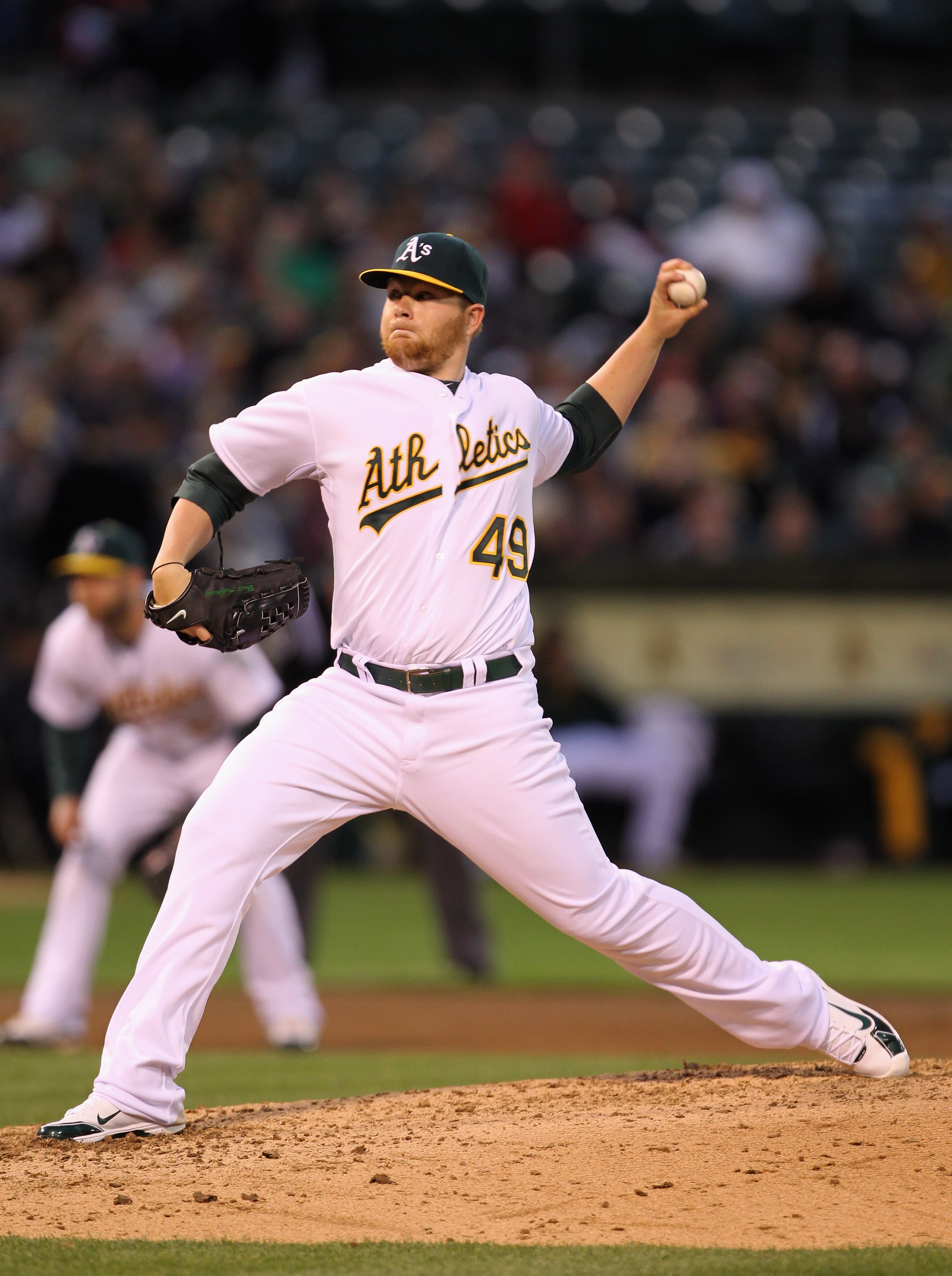 OAKLAND, CA - APRIL 19:  Brett Anderson #49 of the Oakland Athletics pitches against the Boston Red Sox at Oakland-Alameda County Coliseum on April 19, 2011 in Oakland, California.  (Photo by Ezra Shaw/Getty Images)