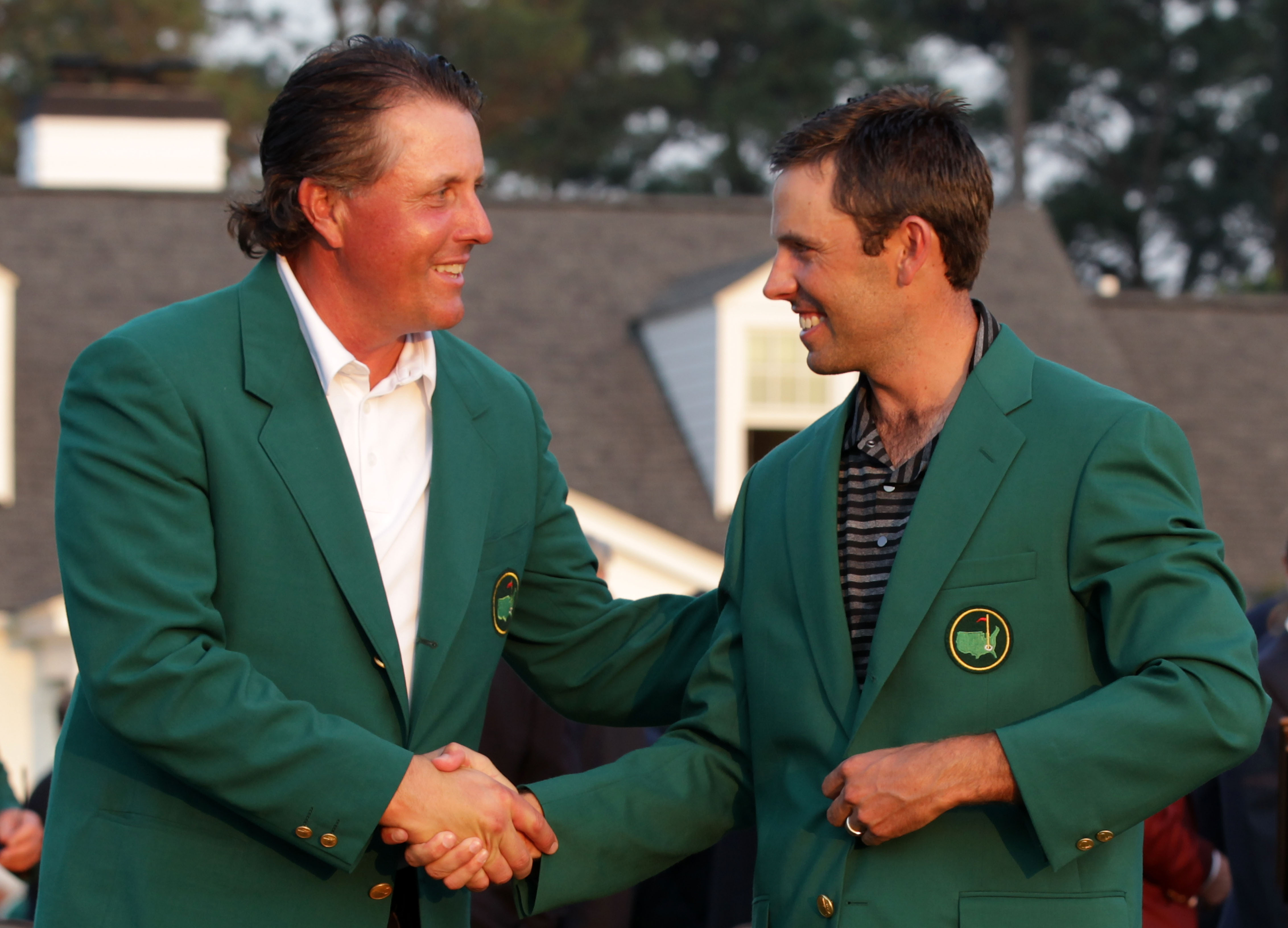 AUGUSTA, GA - APRIL 10:  Phil Mickelson (L) shakes hands with Charl Schwartzel of South Africa at the green jacket presentation after Schwartzel's two-stroke victory at the 2011 Masters Tournament at Augusta National Golf Club on April 10, 2011 in Augusta