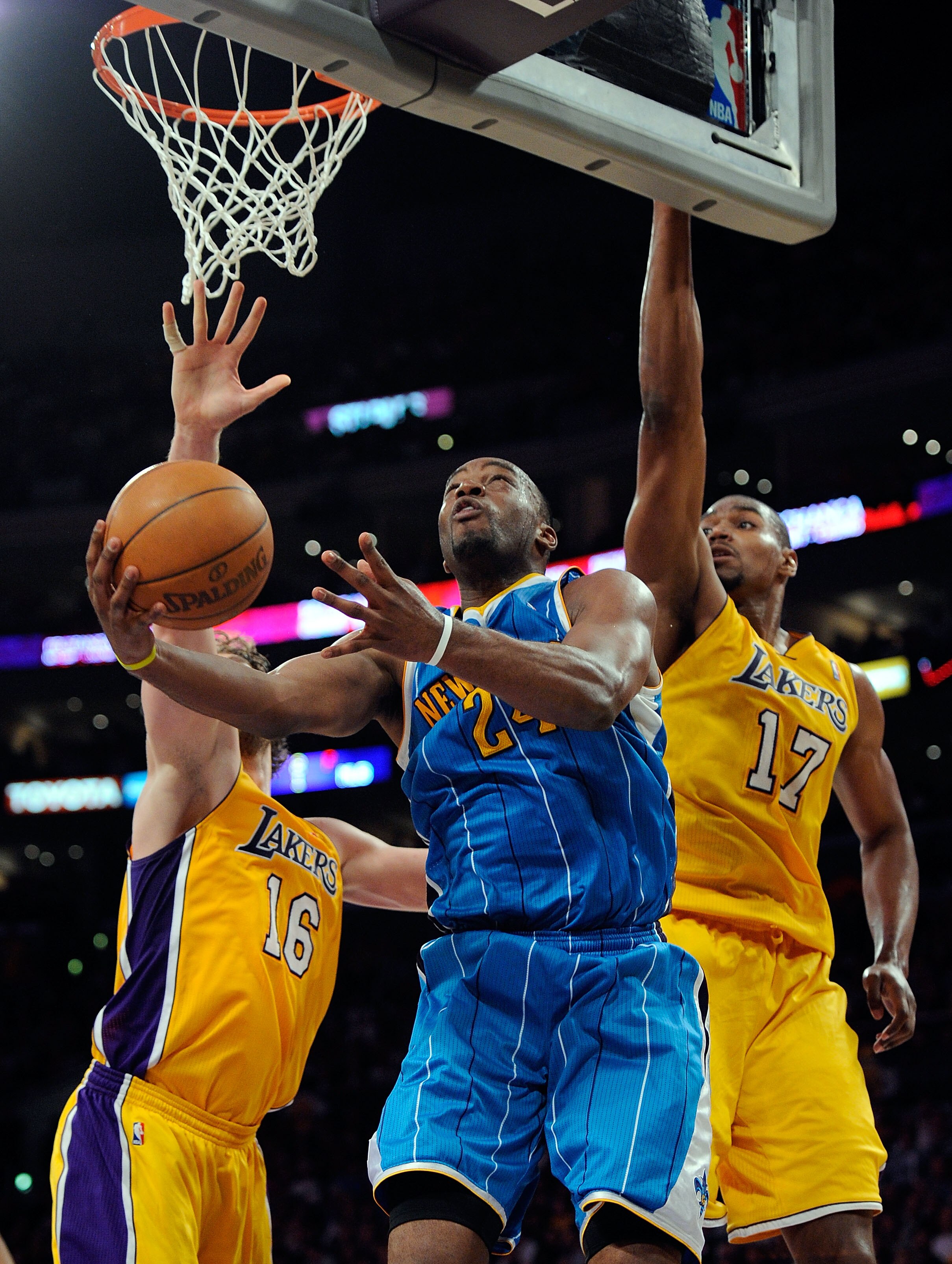 LOS ANGELES, CA - APRIL 20:  Carl Landry #24 of the New Orleans Hornets goes up for a shot between Pau Gasol #16 and Andrew Bynum #17 of the Los Angeles Lakers in Game Two of the Western Conference Quarterfinals in the 2011 NBA Playoffs on April 20, 2011