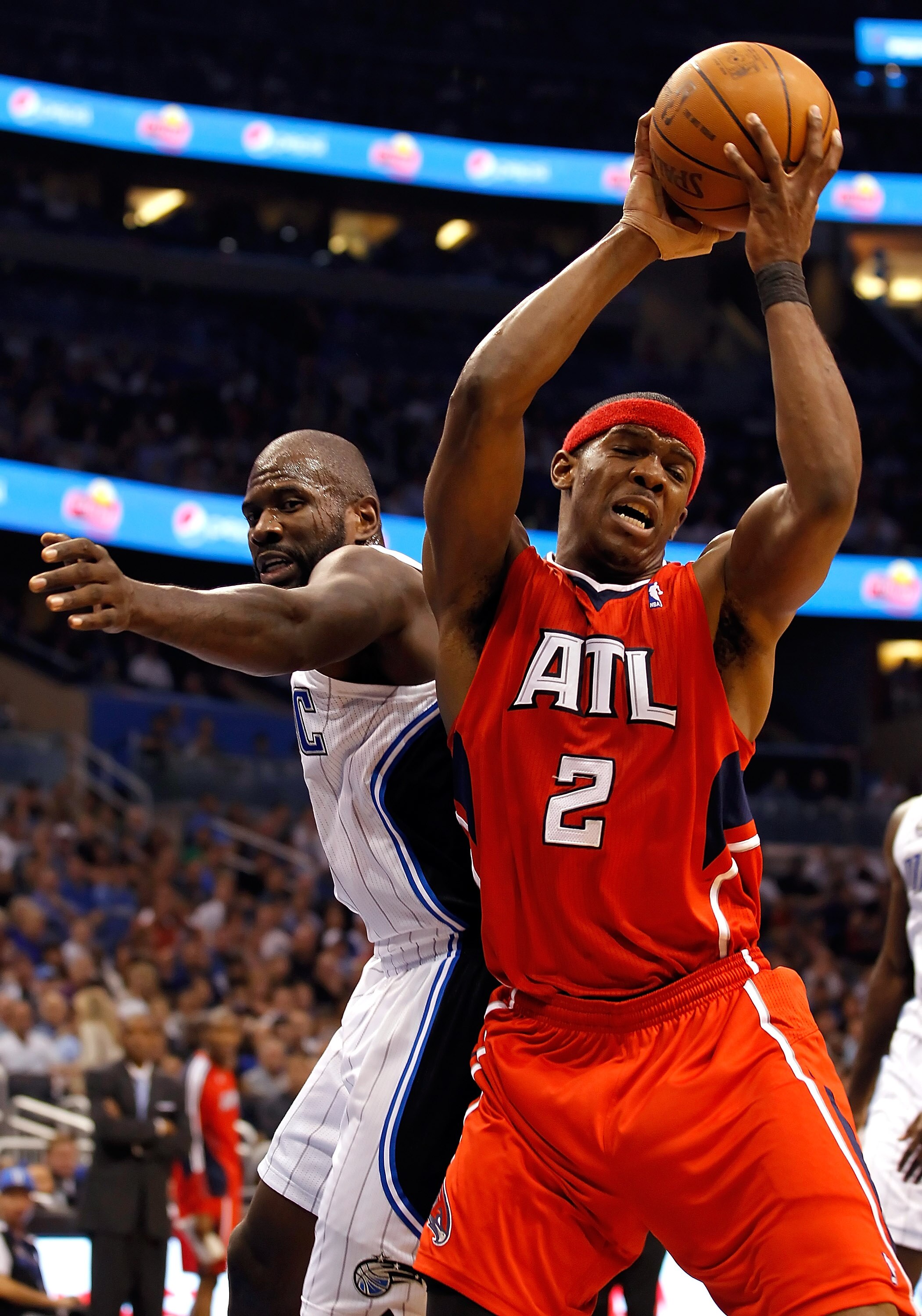 ORLANDO, FL - APRIL 19: Joe Johnson #2 of the Atlanta Hawks rebounds against the Orlando Magic during Game Two of the Eastern Conference Quarterfinals of the 2011 NBA Playoffs on April 19, 2011 at the Amway Arena in Orlando, Florida. NOTE TO USER: User ORLANDO, FL - APRIL 19: Joe Johnson #2 of the Atlanta Hawks rebounds against the Orlando Magic during Game Two of the Eastern Conference Quarterfinals of the 2011 NBA Playoffs on April 19, 2011 at the Amway Arena in Orlando, Florida. NOTE TO USER: User