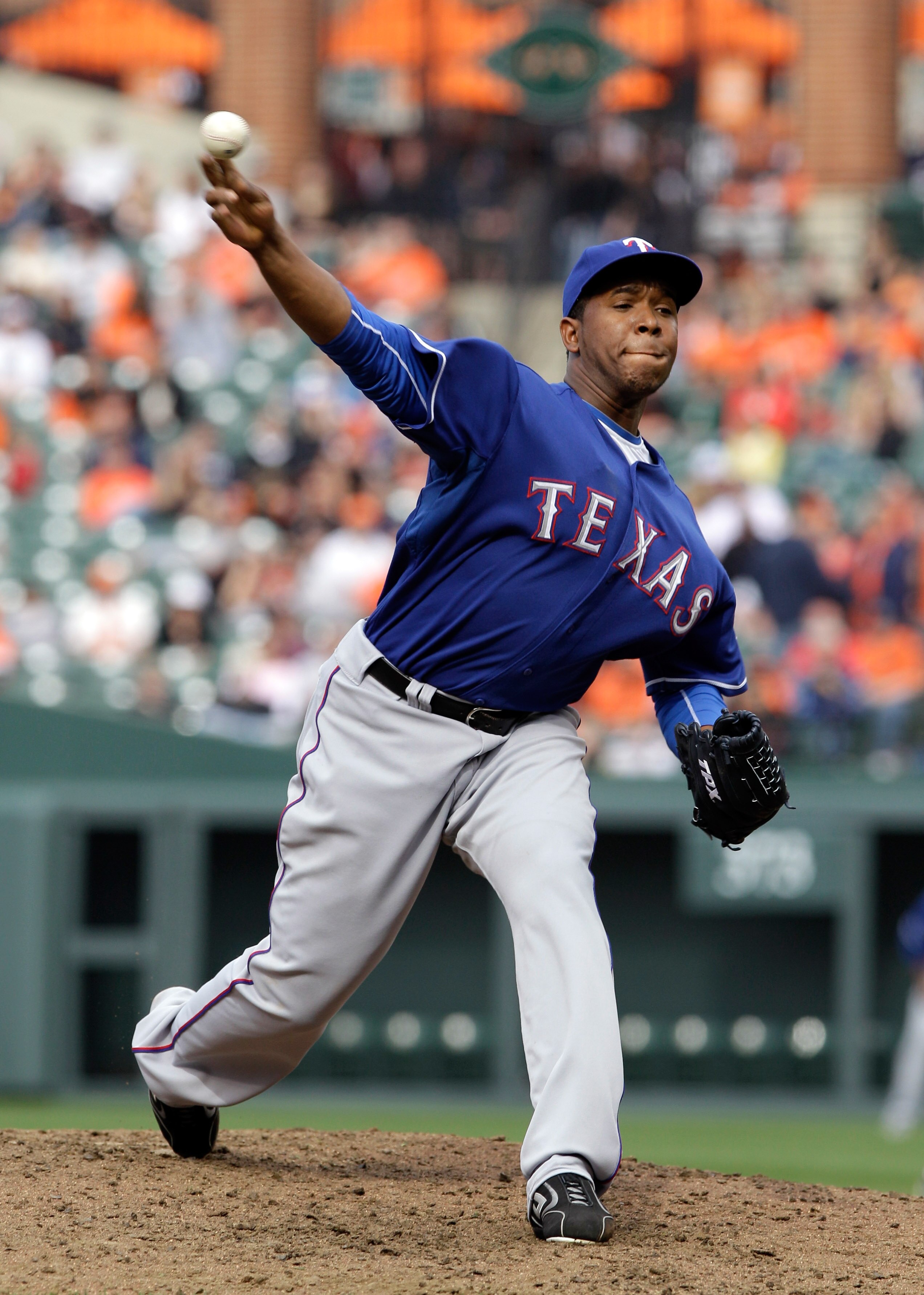 BALTIMORE, MD - APRIL 10: Relief pitcher Neftali Feliz #30 of the Texas Rangers delivers to a Baltimore Orioles batter during the ninth inning at Oriole Park at Camden Yards on April 10, 2011 in Baltimore, Maryland.  (Photo by Rob Carr/Getty Images)