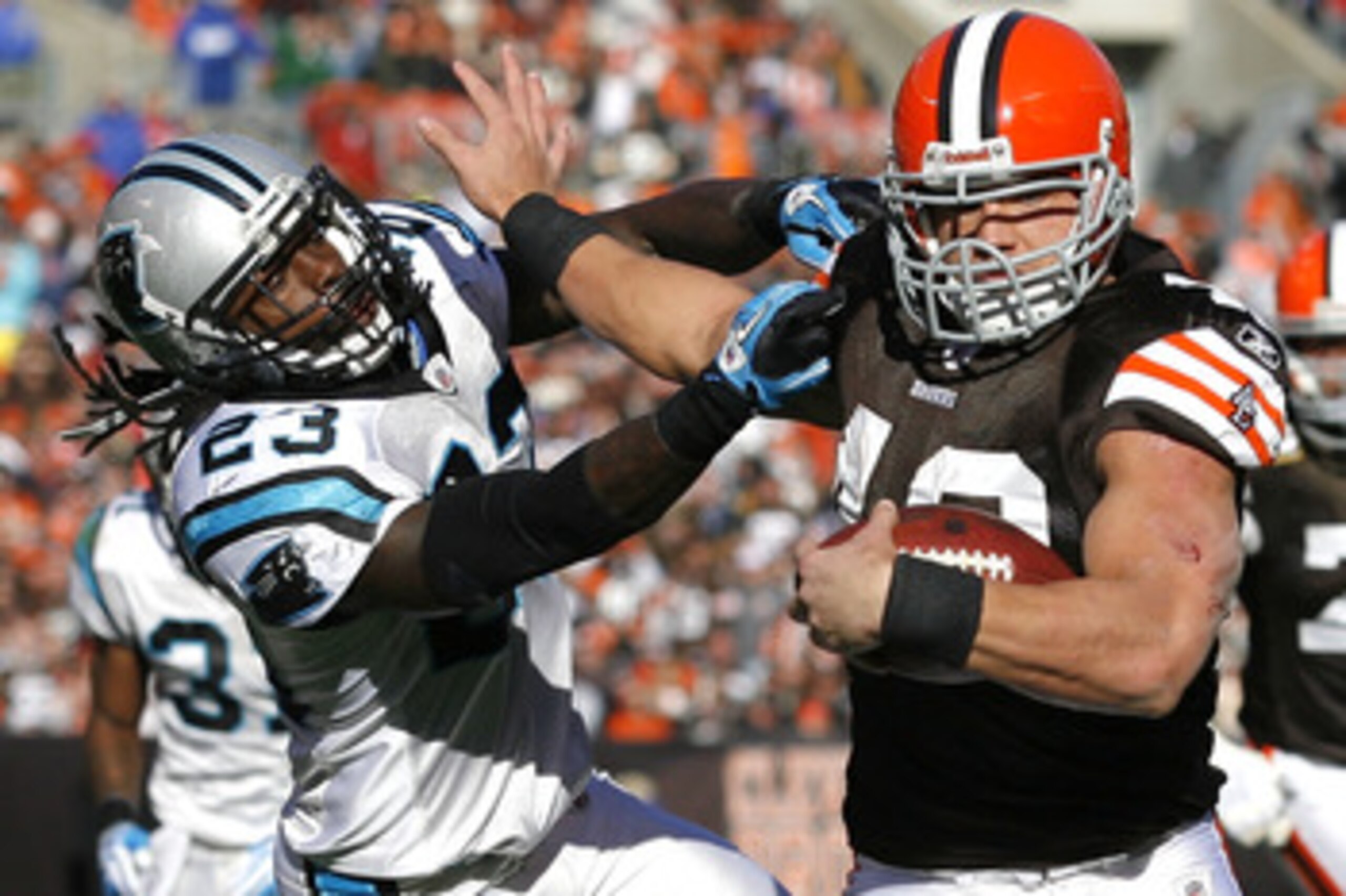 CLEVELAND - NOVEMBER 28:  Running back Peyton Hillis #40 of the Cleveland Browns scores a touchdown as he runs from safety Sherrod Martin #23 of the Carolina Panthers at Cleveland Browns Stadium on November 28, 2010 in Cleveland, Ohio.  (Photo by Matt Sul