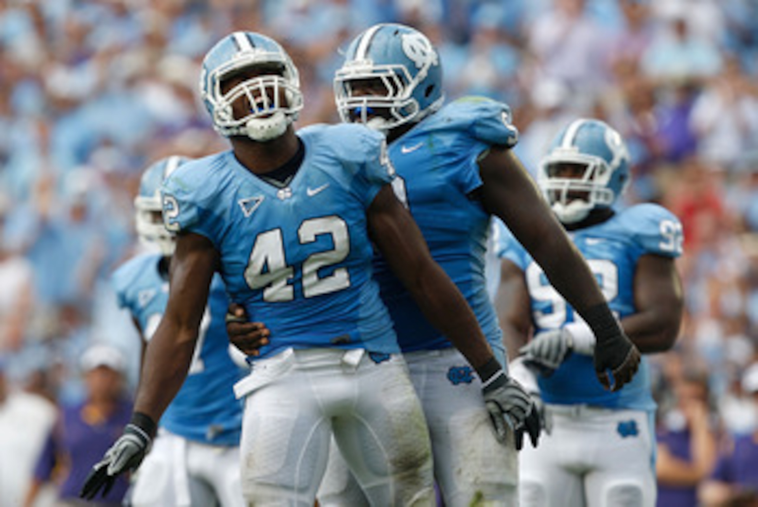 CHAPEL HILL, NC - SEPTEMBER 19: Robert Quinn #42 of the North Carolina Tar Heels celebrates after a sack with teammate Marvin Austin #9 against the East Carolina Pirates at Kenan Stadium on September 19, 2009 in Chapel Hill, North Carolina. (Photo by St CHAPEL HILL, NC - SEPTEMBER 19: Robert Quinn #42 of the North Carolina Tar Heels celebrates after a sack with teammate Marvin Austin #9 against the East Carolina Pirates at Kenan Stadium on September 19, 2009 in Chapel Hill, North Carolina. (Photo by St