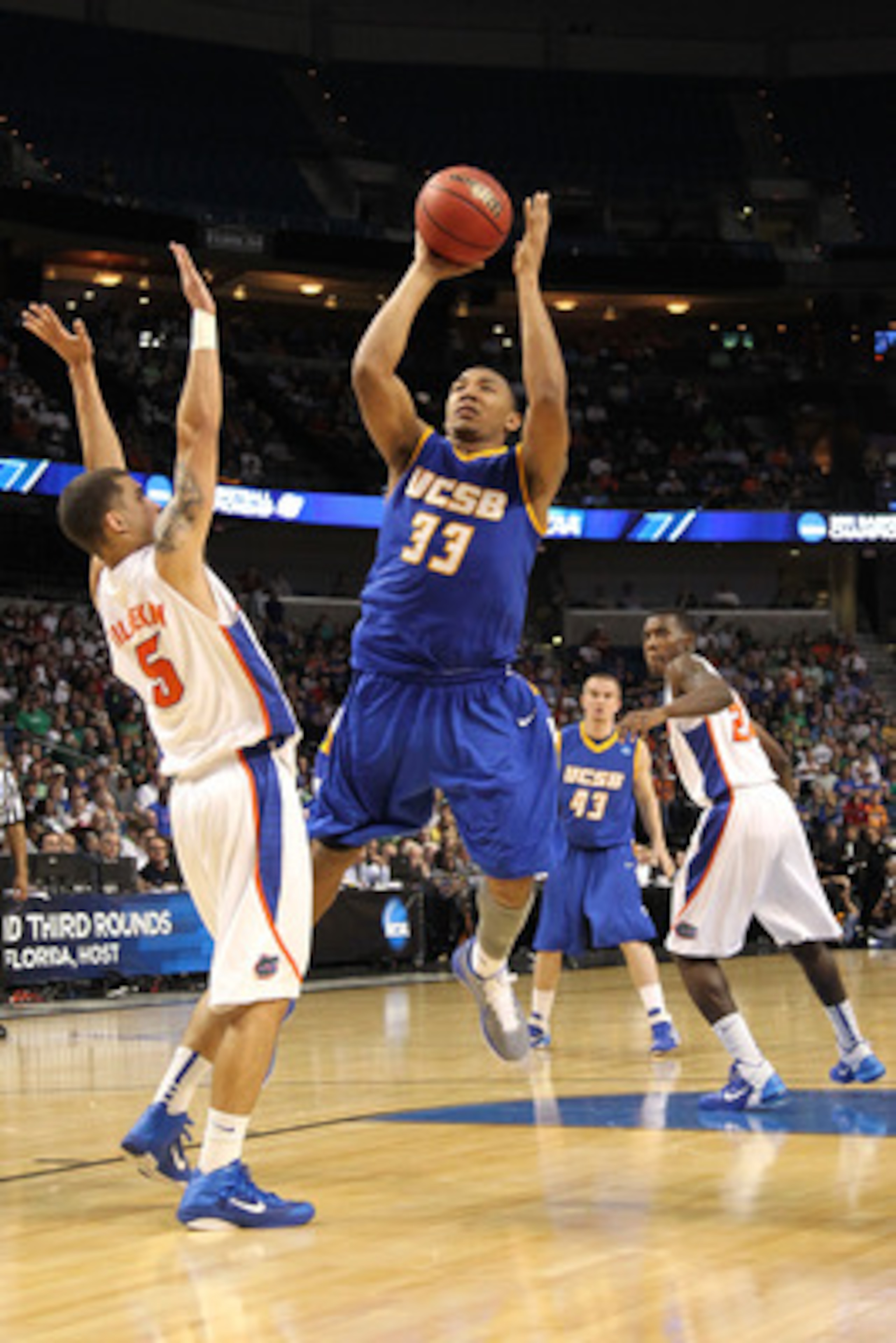 TAMPA, FL - MARCH 17:  Orlando Johnson #33 of the UC Santa Barbara Gauchos drives for a shot attempt against Scottie Wilbekin #5 of the Florida Gators during the second round of the 2011 NCAA men's basketball tournament at St. Pete Times Forum on March 17