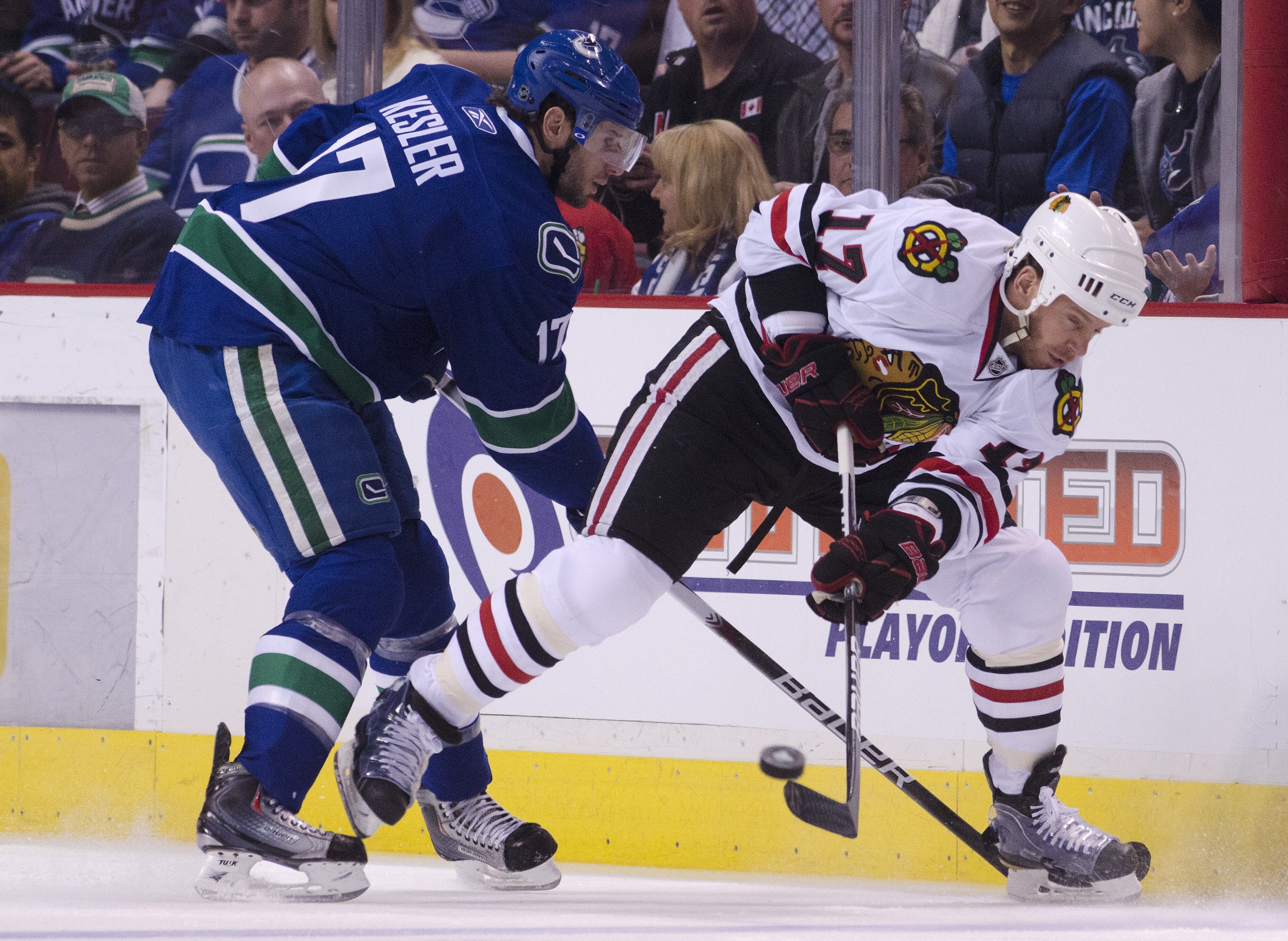 VANCOUVER, CANADA - APRIL 21: Ryan Kesler #17 of the Vancouver Canucks checks Ryan Johnson #17 of the Chicago Blackhawks as he clear the puck during the first period in Game Five of the Western Conference Quarterfinals during the 2011 NHL Stanley Cup Play VANCOUVER, CANADA - APRIL 21: Ryan Kesler #17 of the Vancouver Canucks checks Ryan Johnson #17 of the Chicago Blackhawks as he clear the puck during the first period in Game Five of the Western Conference Quarterfinals during the 2011 NHL Stanley Cup Play