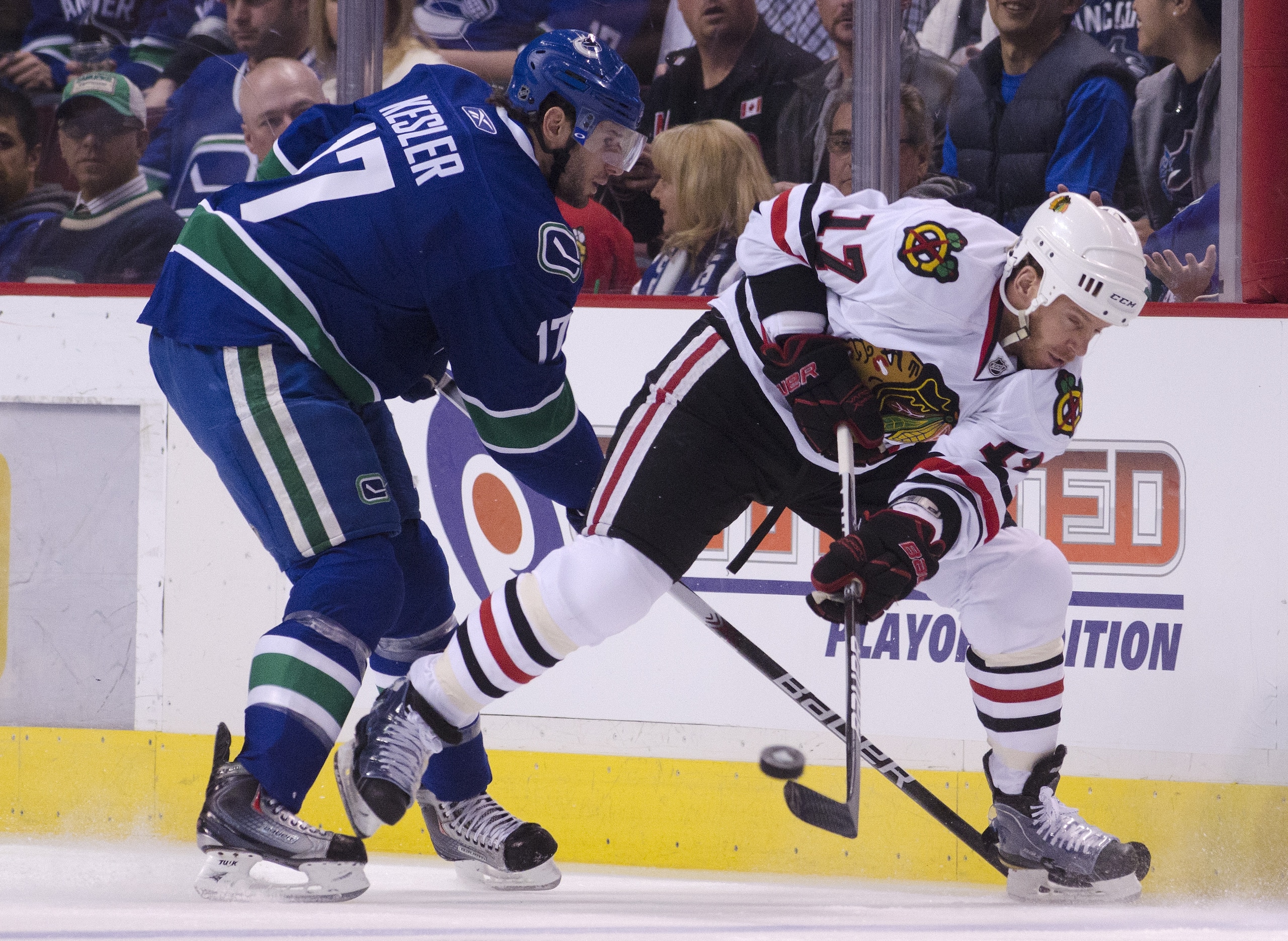 VANCOUVER, CANADA - APRIL 21: Ryan Kesler #17 of the Vancouver Canucks checks Ryan Johnson #17 of the Chicago Blackhawks as he clear the puck during the first period in Game Five of the Western Conference Quarterfinals during the 2011 NHL Stanley Cup Play